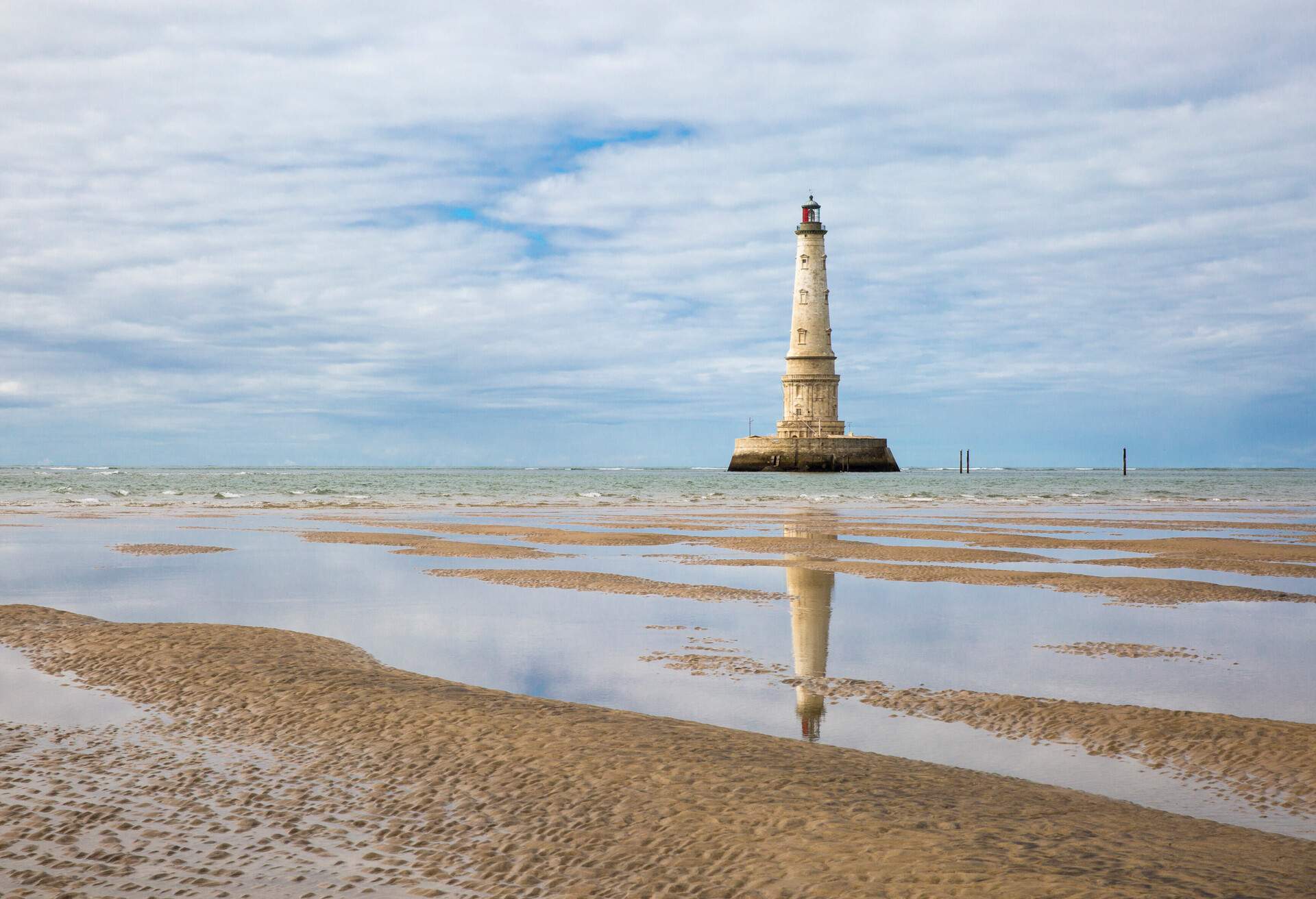 view of the historical lighthouse of Cordouan at low tide, Gironde estuary, France