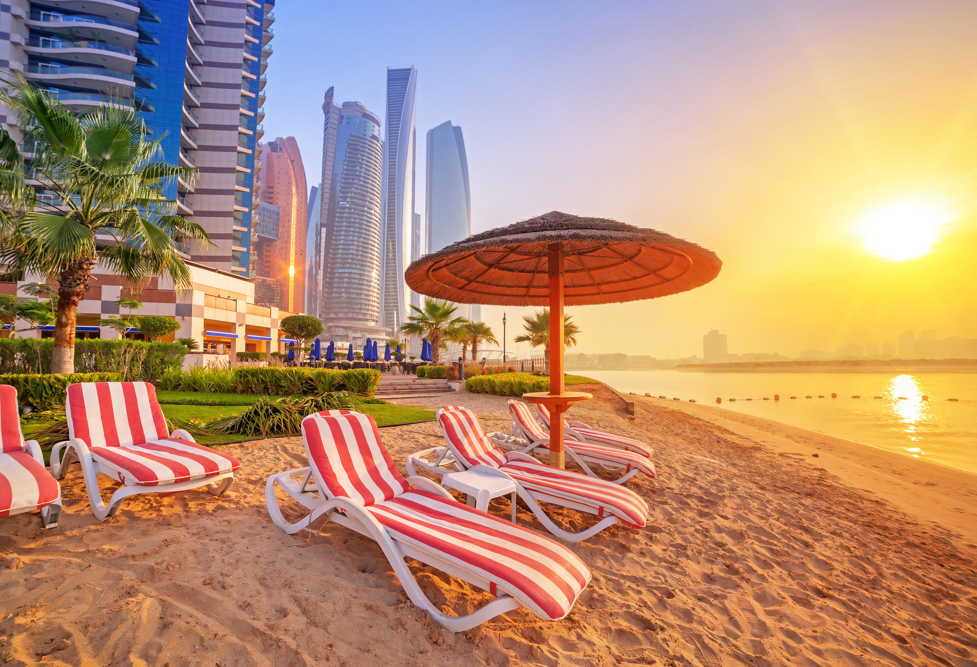 Sunrise on the beach at Perian Gulf in Abu Dhabi; Shutterstock ID 228261805