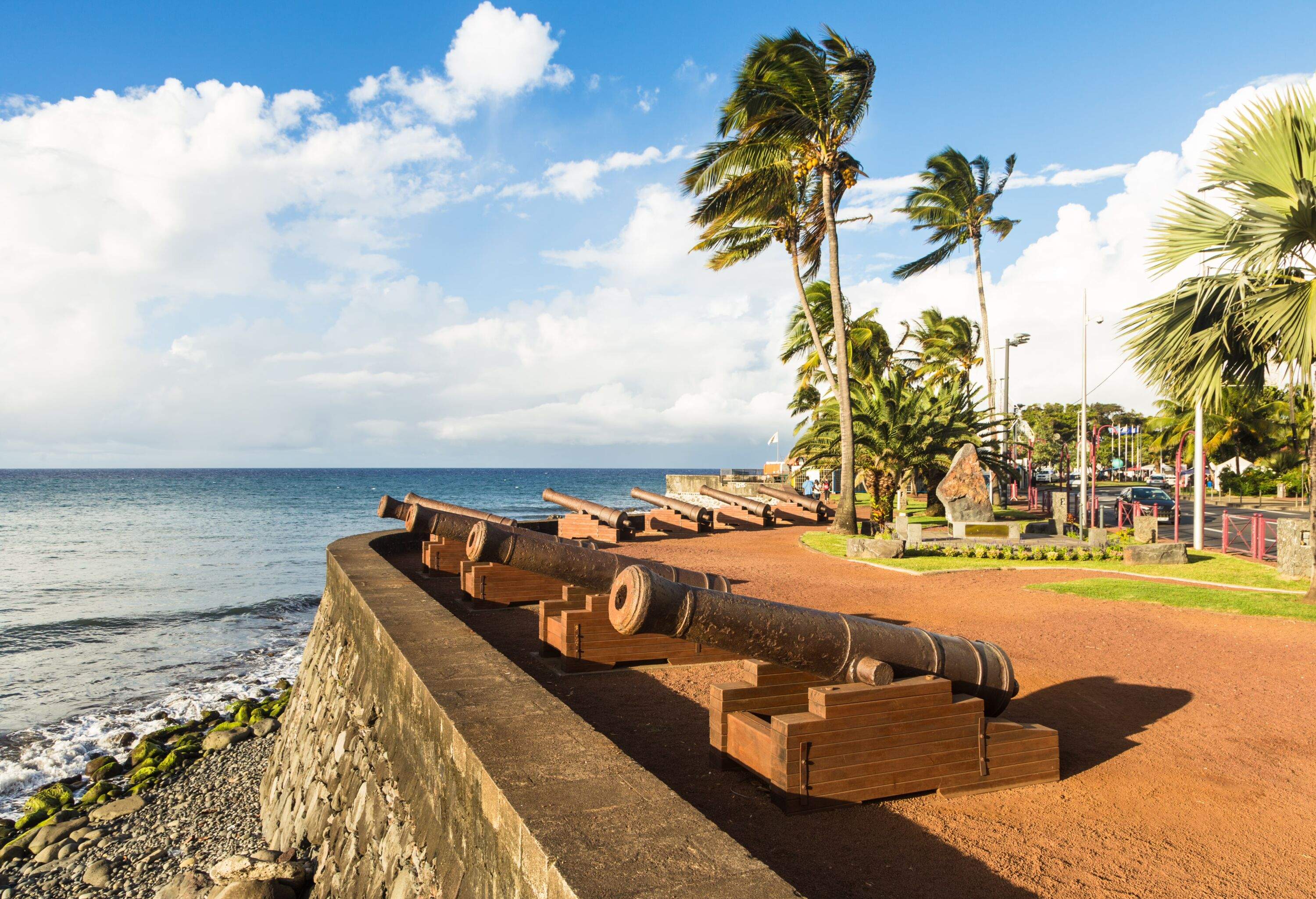 Old bronze canons displayed on the waterfront promenade along the Indian ocean in Saint Denis, the capital city of the Reunion island, which belongs to France