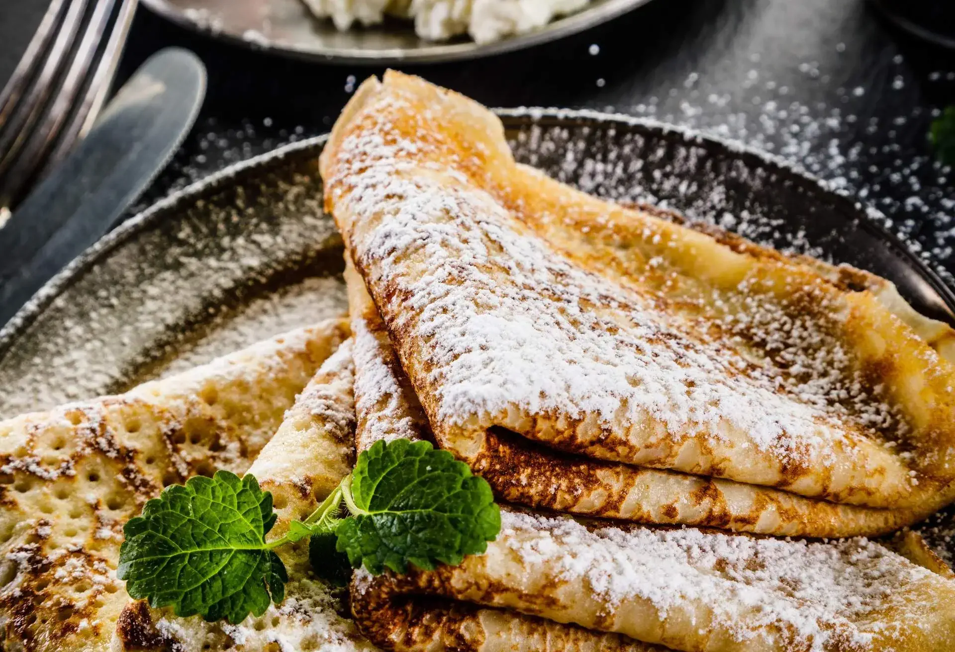 Close up of a french crepe with sprinkled sugar