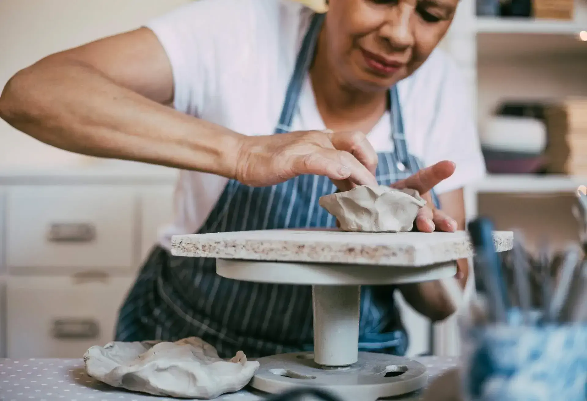 Close up of woman working clay in a pottery studio