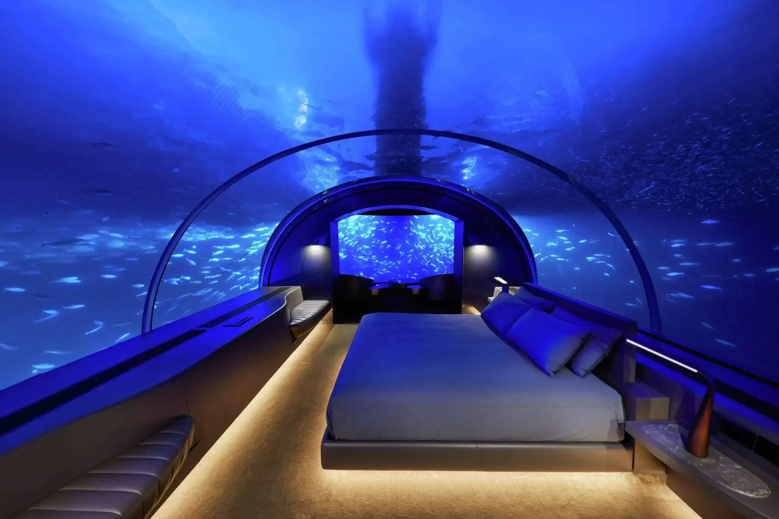A hotel bedroom under the sea that looks like an aquarium