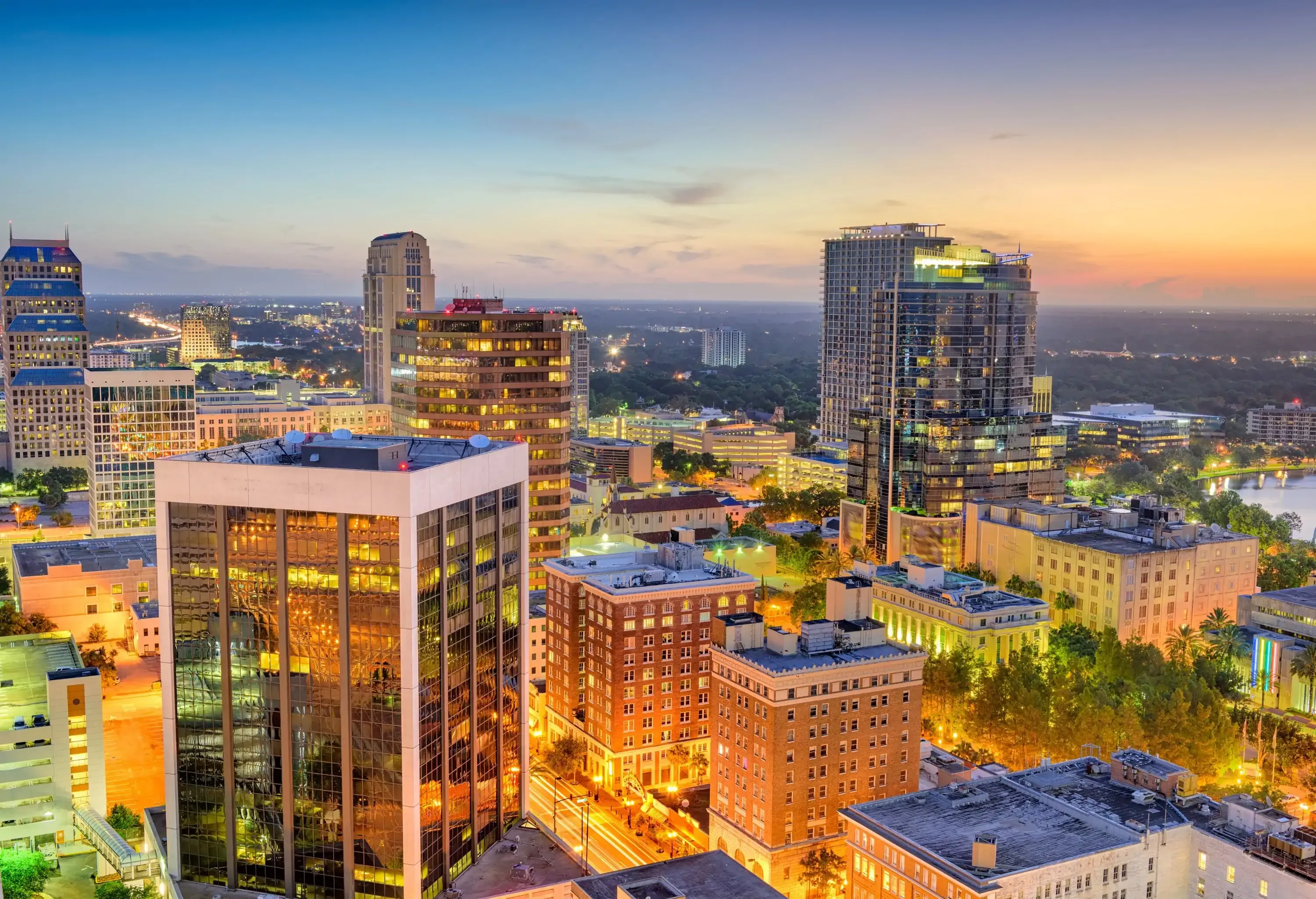 Beautiful skyscrapers lighting up at the city at sunset.