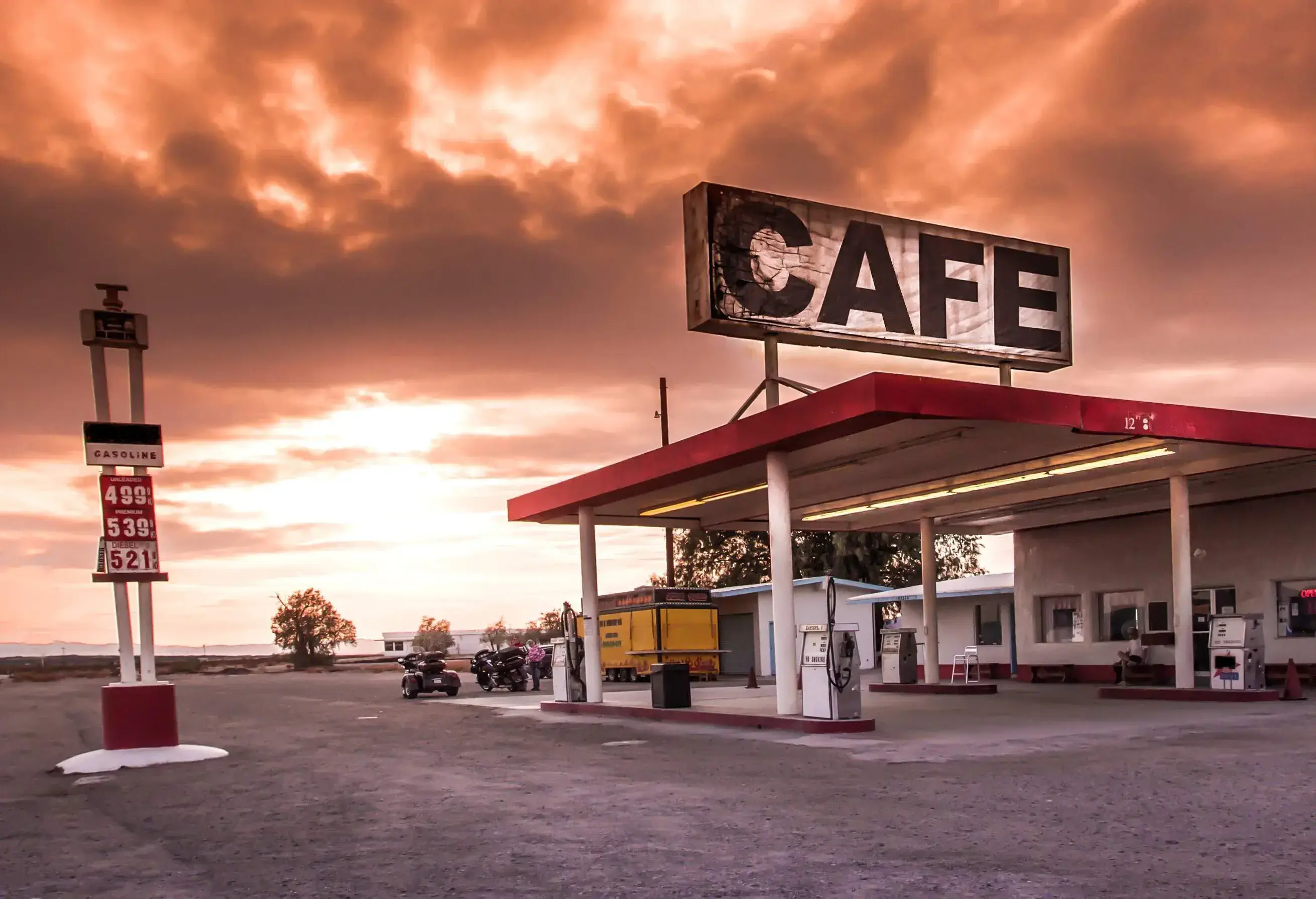 A photo of an American gas station with a Cafe sign on top.