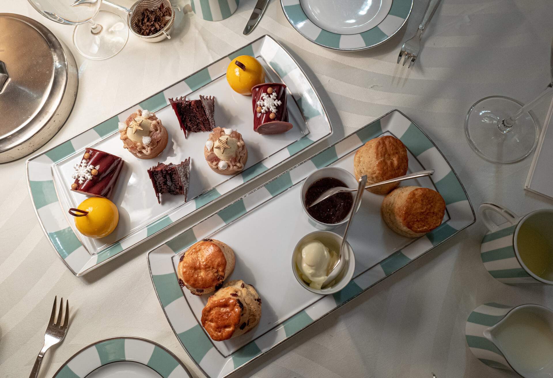 A selection of teatime treats served with clotted cream and jam.