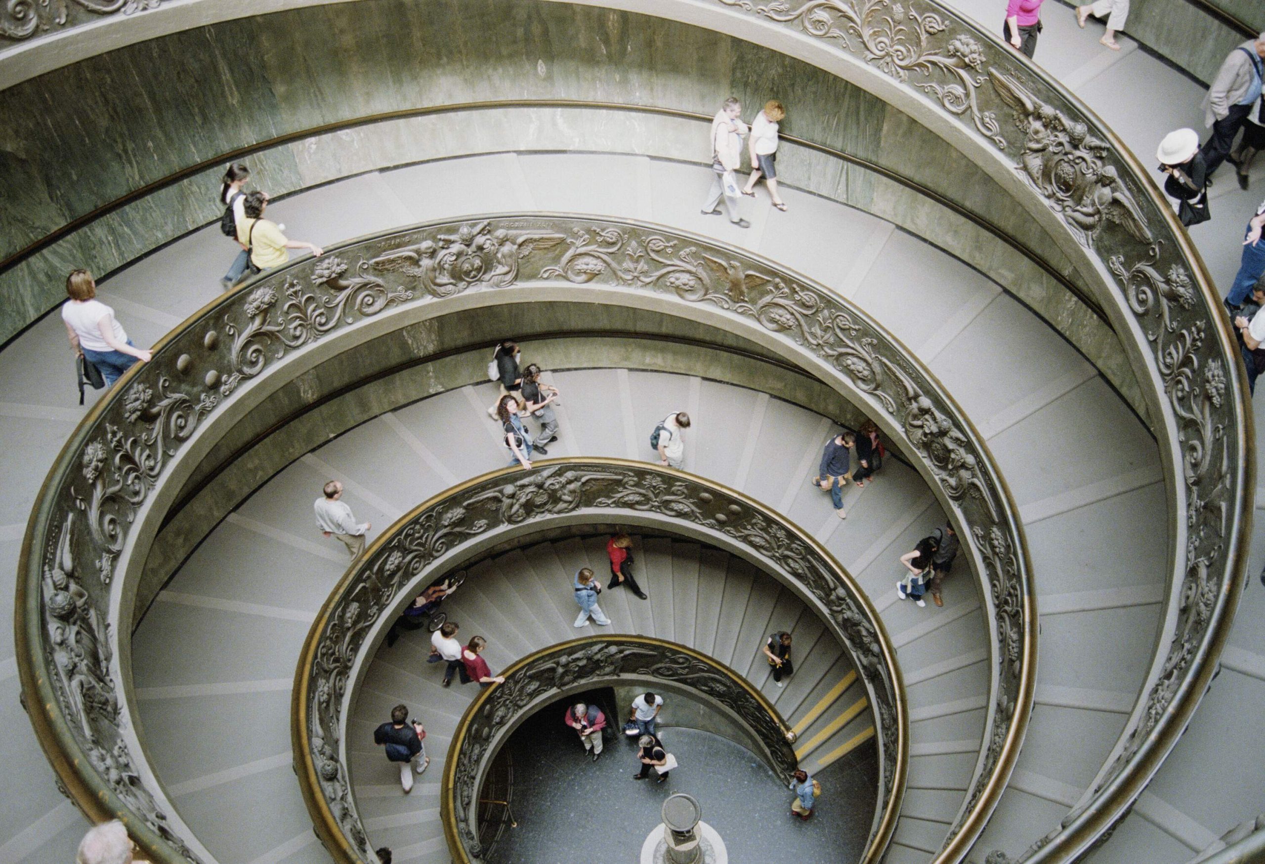 People making their way down the Bramante Staircase in the Vatican Museums.