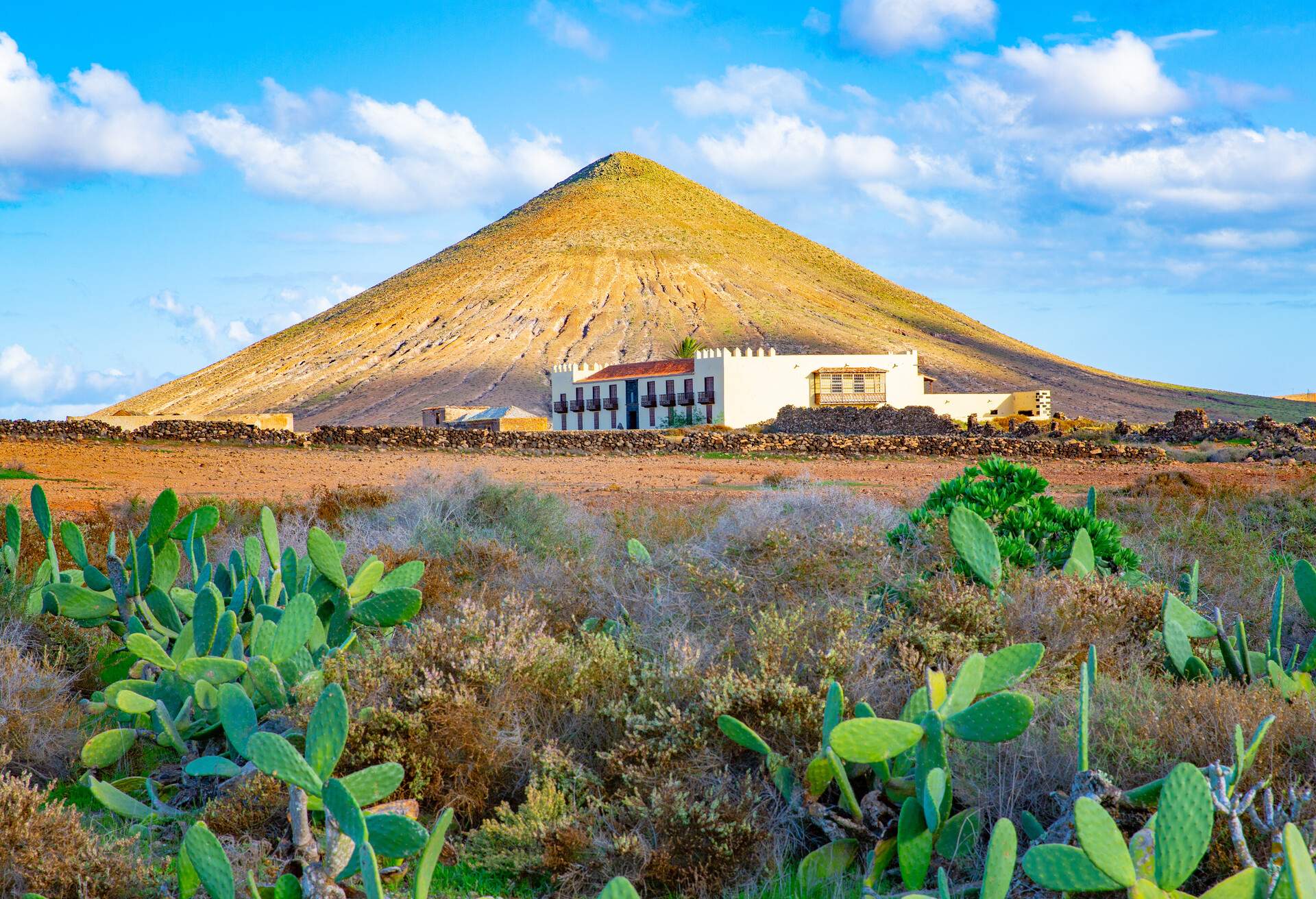 Montana de Tindaya and the Casa de los Coroneles in La Oliva, Fuerteventura Island, Canary Islands, Spain; Shutterstock ID 1253500273; purchase_order: ; job: ; client: ; other: