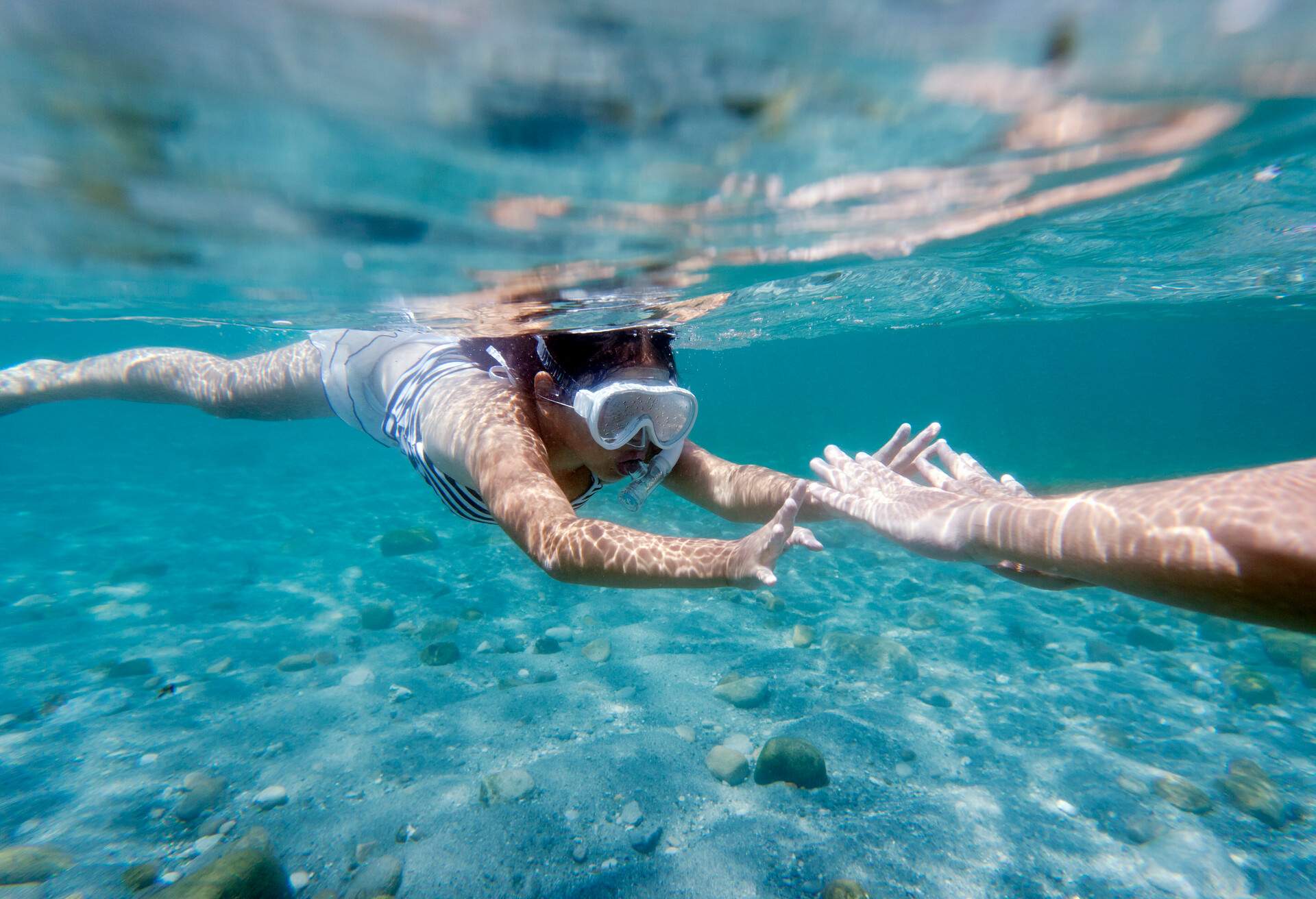 THEME_PEOPLE_GIRL_SNORKELING_SWIMMING_BEACH_SEA_GettyImages-131249654