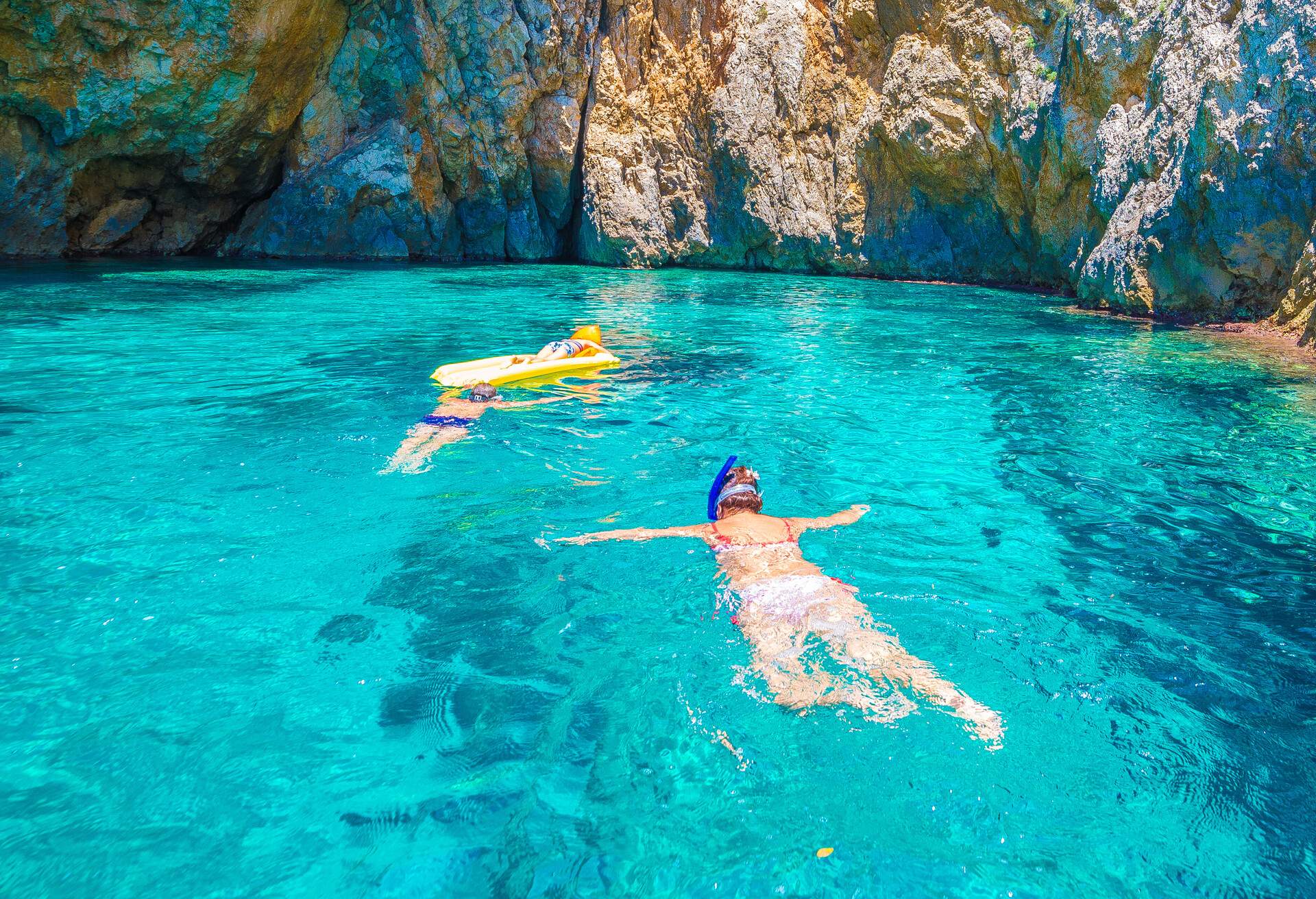 Snorkling in the blue lagoon of Palaiokastritsa, Corfu island, Greece; Shutterstock ID 1110995276; Purpose: Corfu; Brand (KAYAK, Momondo, Any): Any