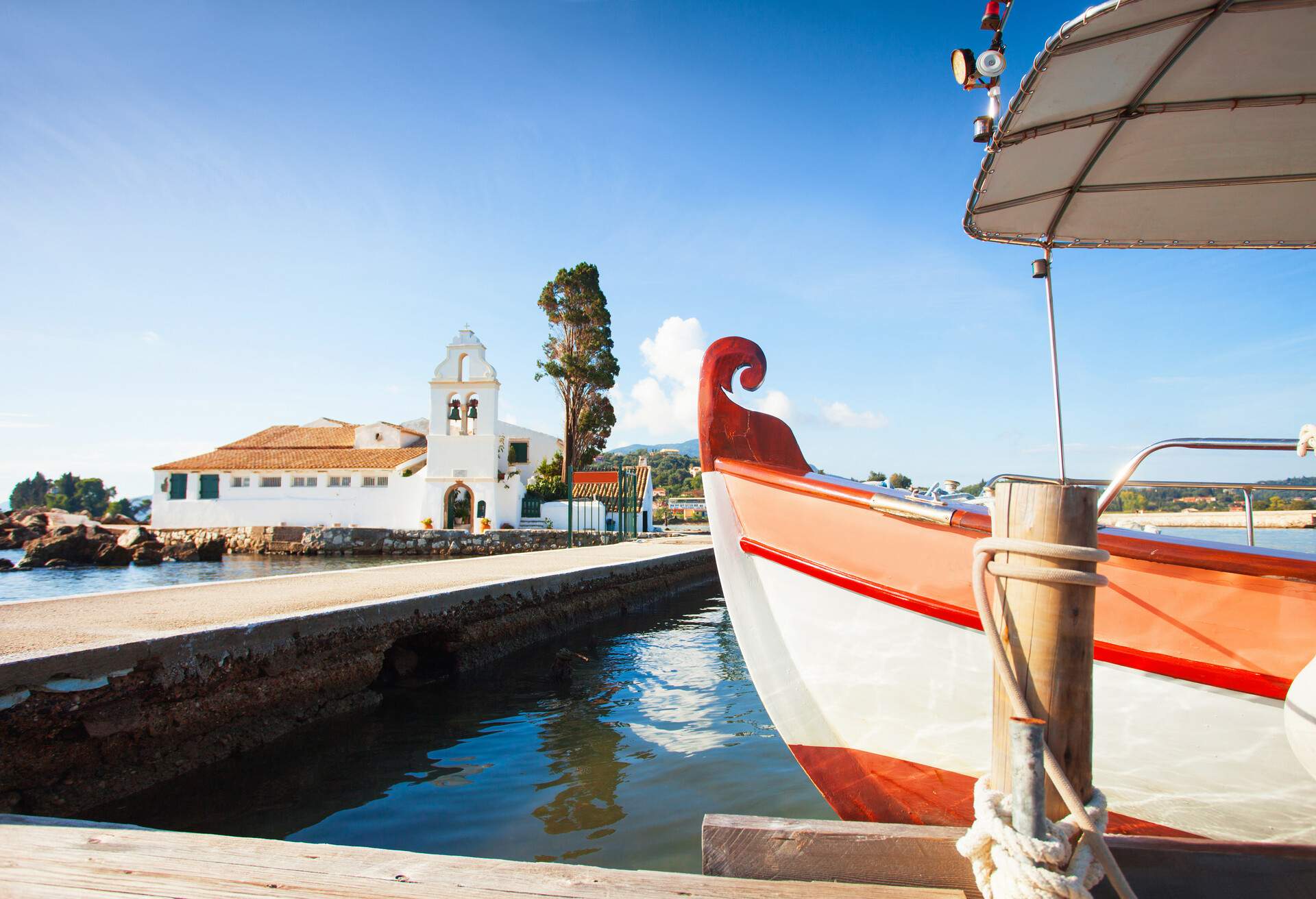 DEST_GREECE_CORFU_Traditional greek boat near Vlacherna Monastery_GettyImages-500542538