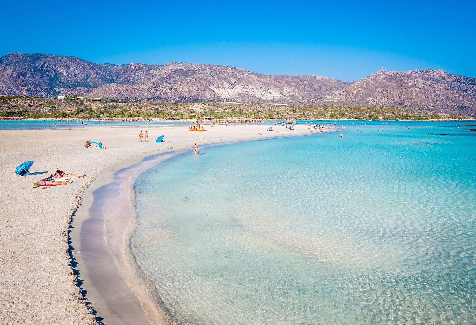 Crete, Greece - Jul 14, 2018: Elafonisi, a paradise beach with turquoise water, an island located close to the southwestern corner of the Mediterranean island of Crete, known for its pink sand beaches