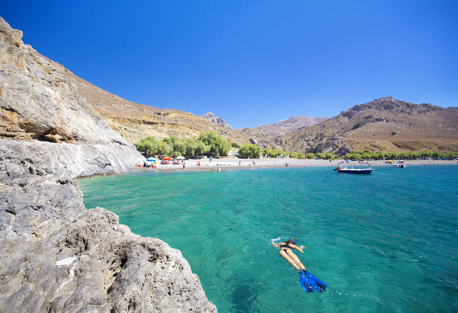 The amazing tropical beach of Panagia Tripiti, in Crete, Greece, with sandy beach, turquoise water and some lucky campers.; Shutterstock ID 689170300; Brand (KAYAK, Momondo, Any): any