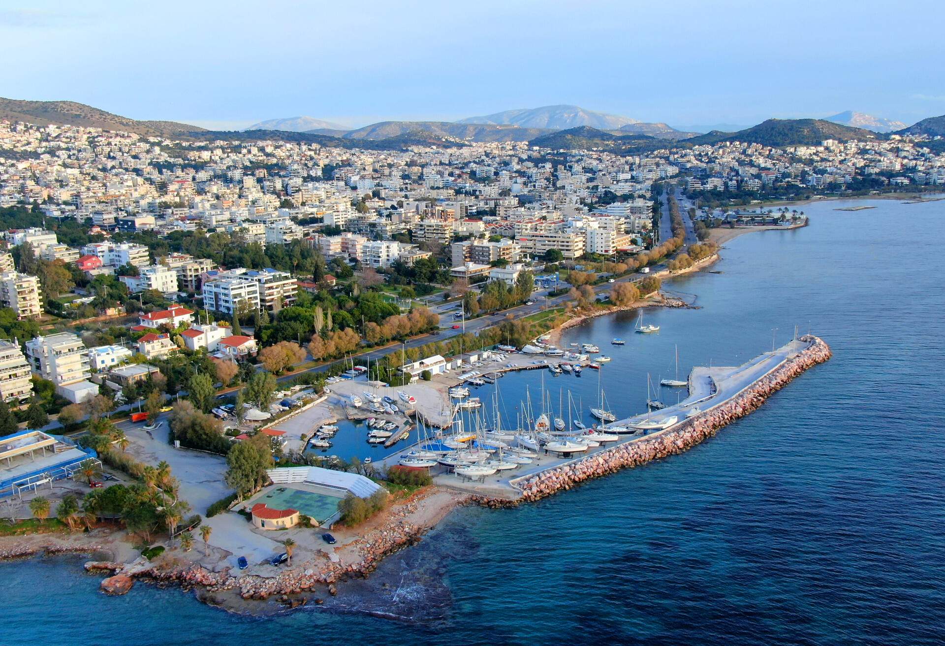 Aerial drone bird's eye view of famous seascape of Athens Riviera at sunset, Voula, Attica, Greece; Shutterstock ID 1275266263