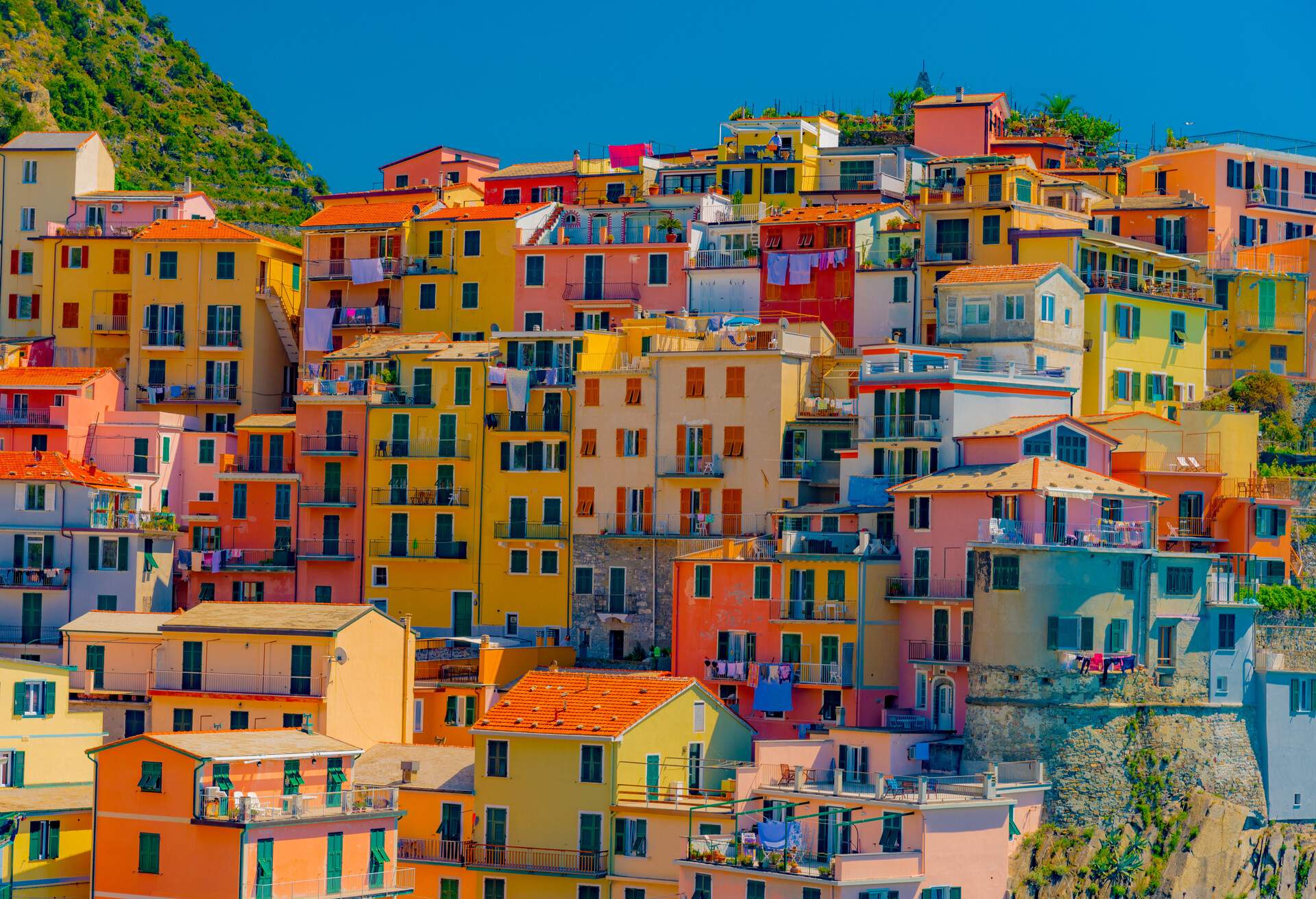 Scenic view of colorful village Manarola and ocean coast in Cinque Terre, Italy; Shutterstock ID 634829582; purchase_order: ; job: KAYAK; client: ; other: