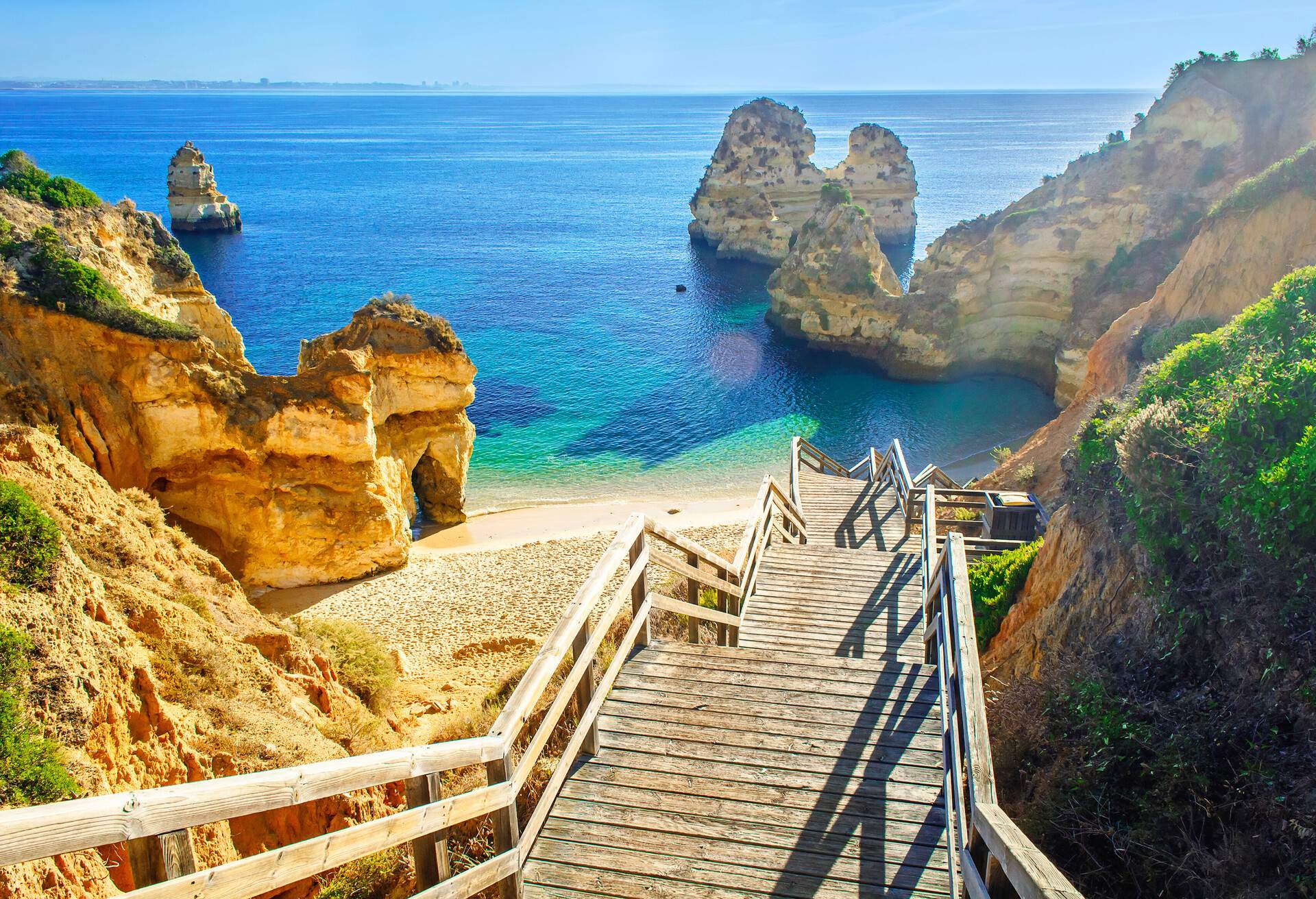 DEST_PORTUGAL_ALGARVE_LAGOS_Praia-do-Camilo-GettyImages-658446924