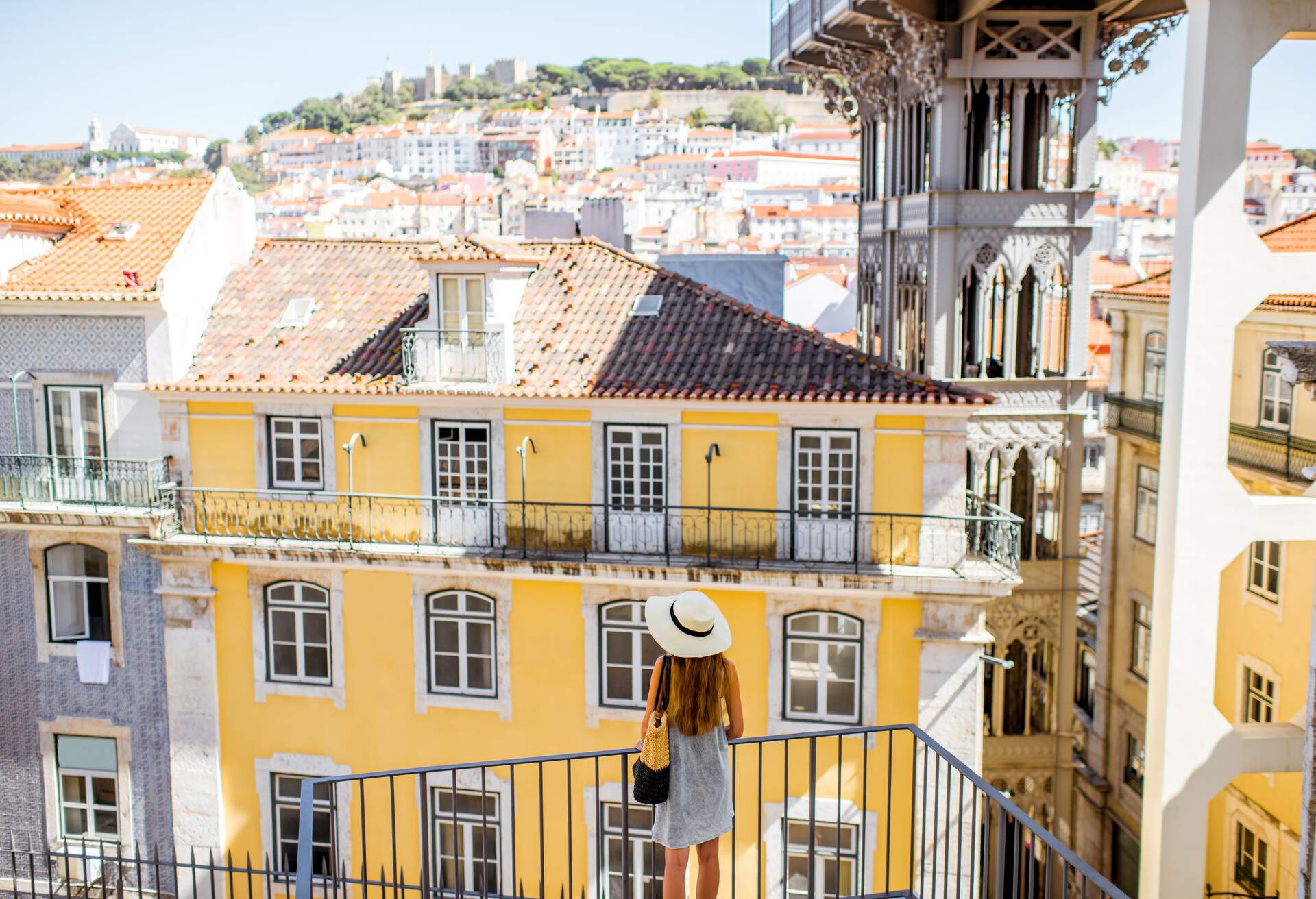 View on the old buildings with famous saint Justa metal lift during the sunny weather in Lisbon city, Portugal; Shutterstock ID 763020433; Purpose: Content; Brand (KAYAK, Momondo, Any): Momondo