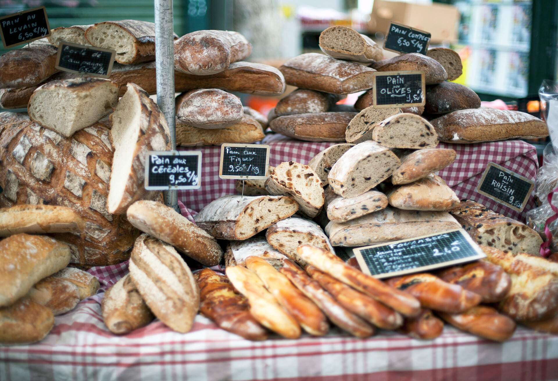 An assortment of bakery bread on a French market stall.