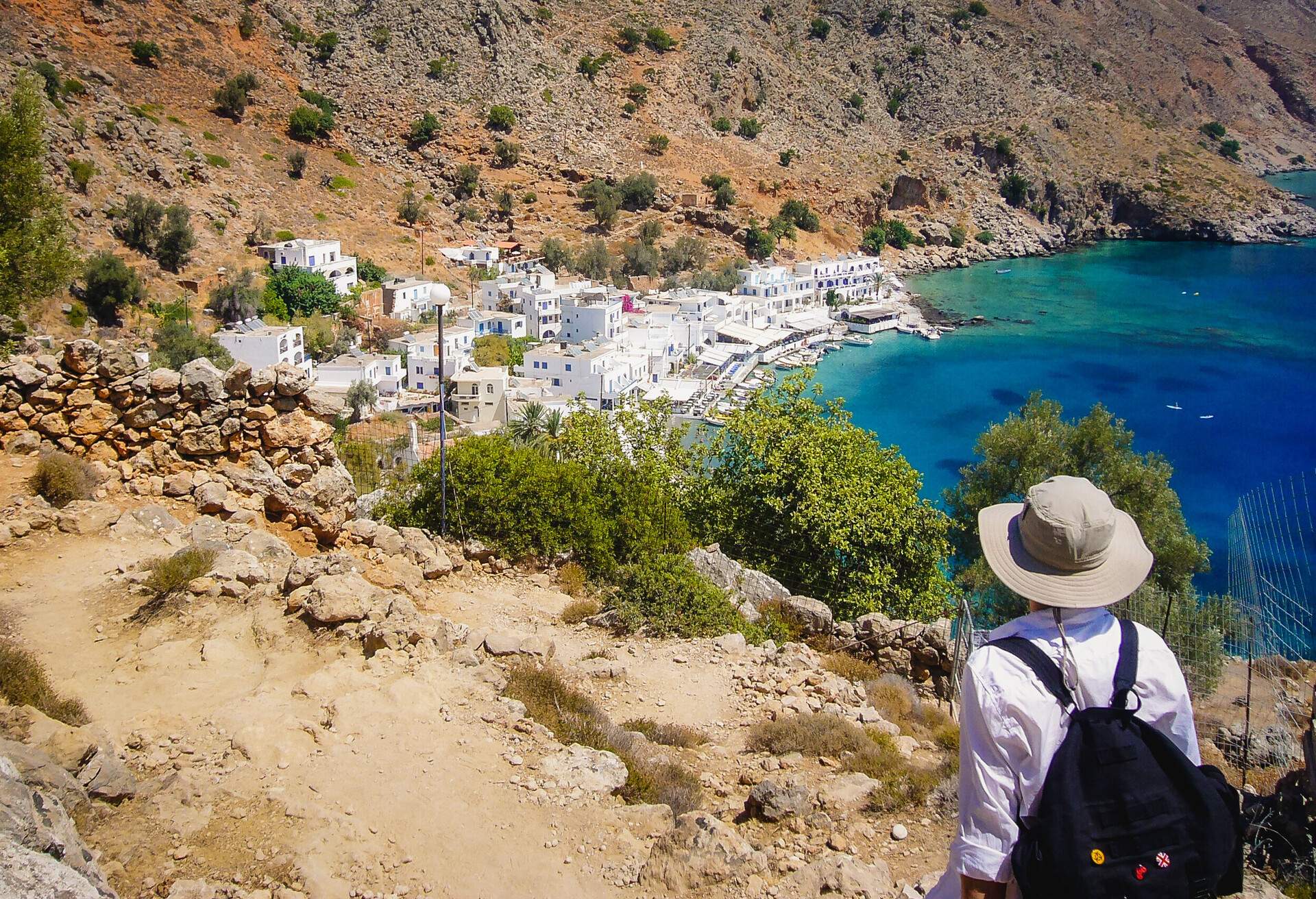 DEST_GREECE_CRETE_LOUTRO_MAN_LOOKING_GettyImages-1184995925