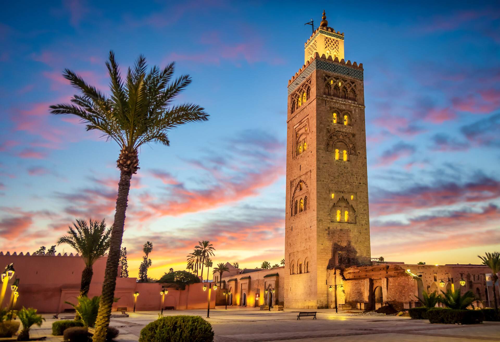 Koutoubia mosque in the morning surrounded by palm tree, Marrakesh, Morocco