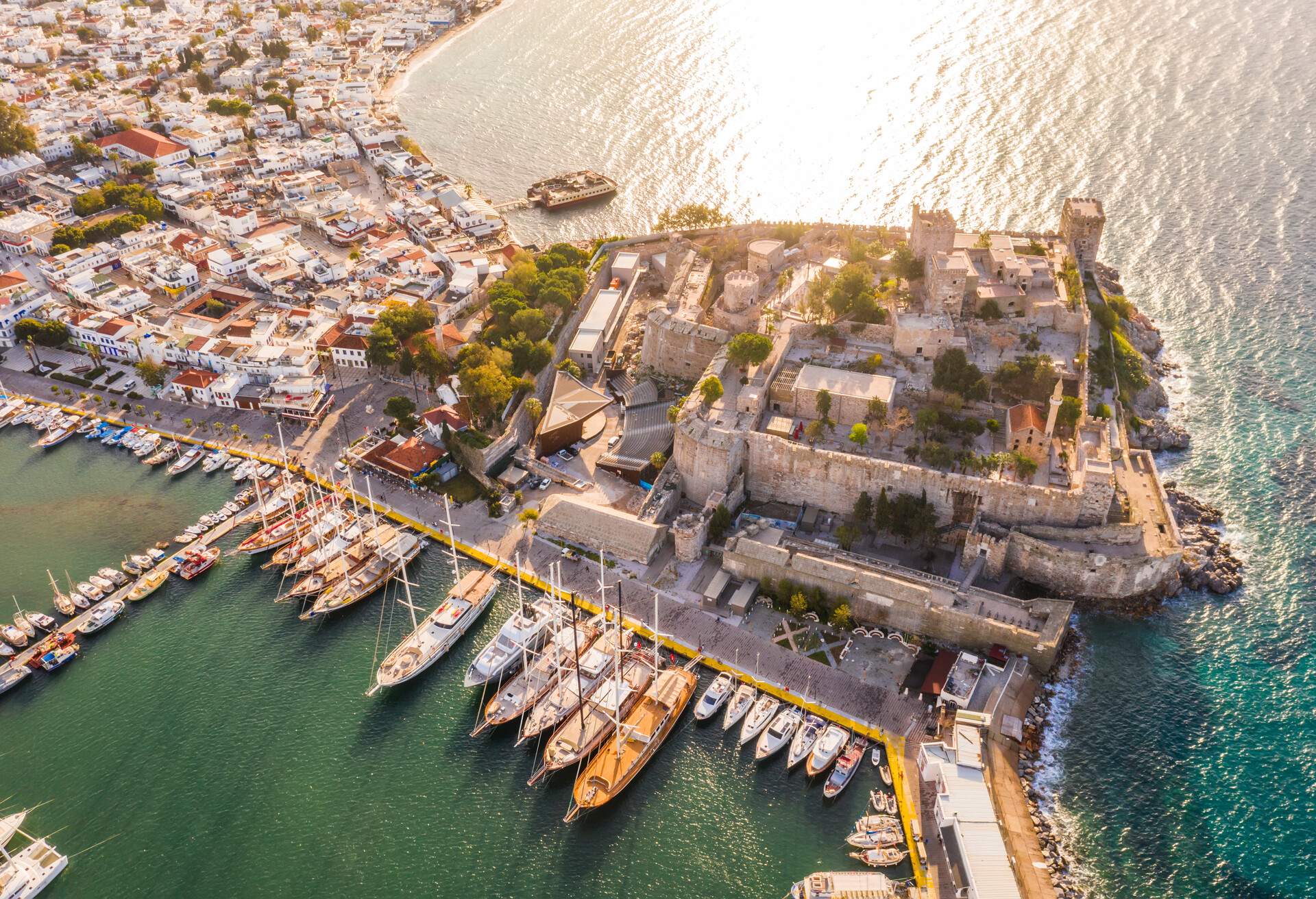 Aerial view of boats and beautiful city in Bodrum, Turkey. Landscape with boats in marina bay, sea