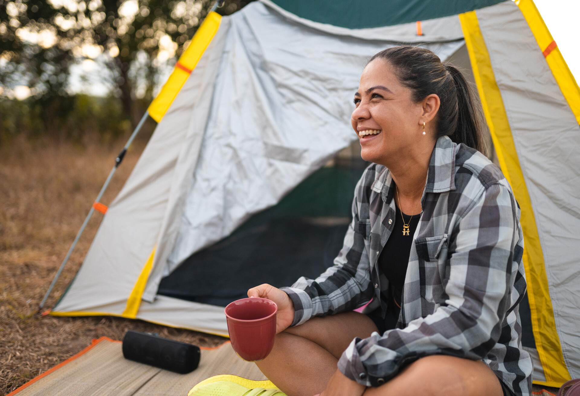 THEME_CAMPING_TENT_WOMAN_GettyImages-1353112075.jpg