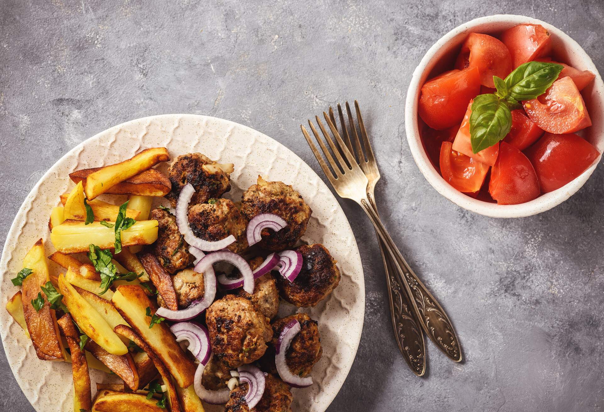 Greek meatballs, keftedes, with fries.