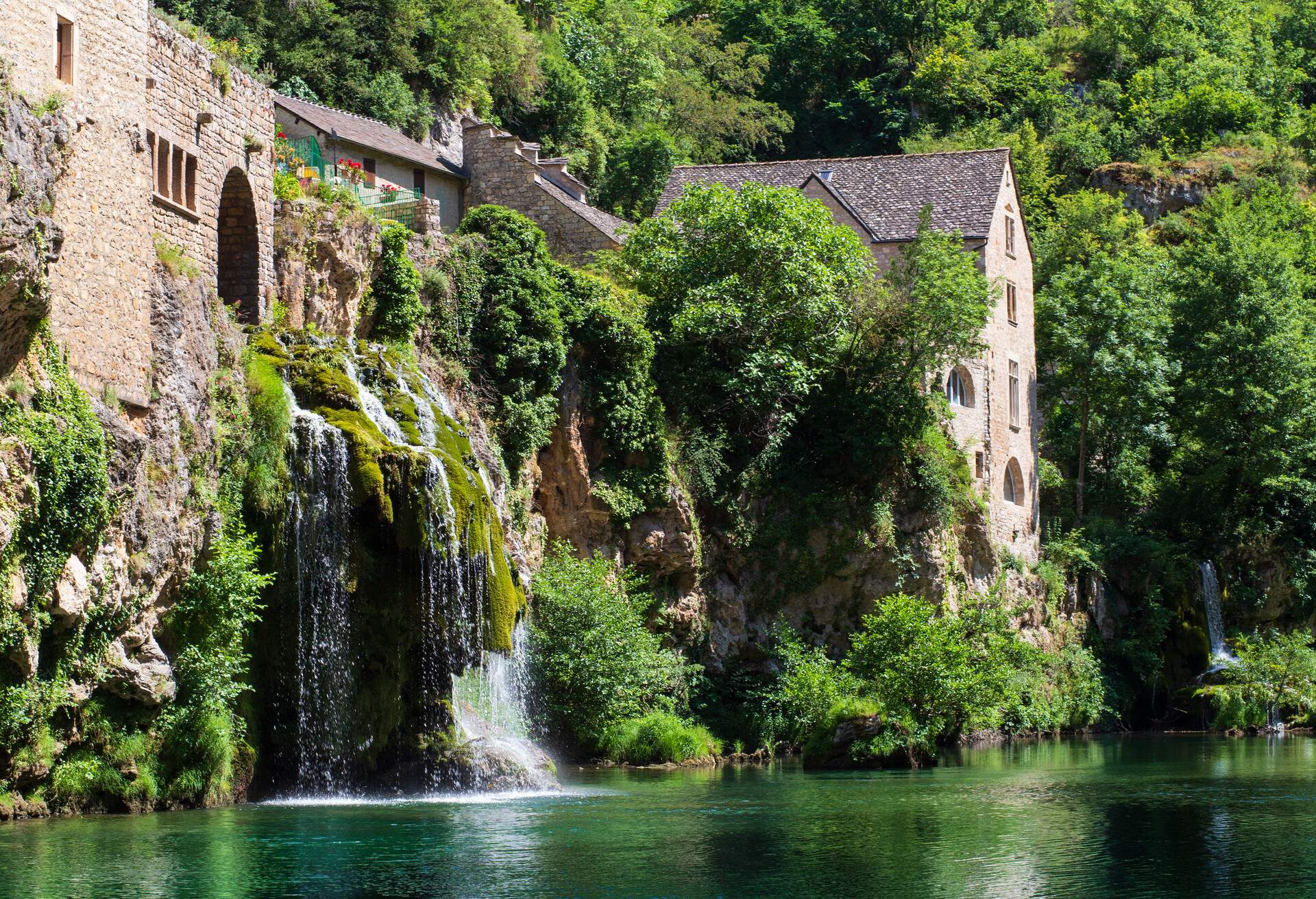 Saint-Chély-du-Tarn village and waterfall, Sainte-Énimie, Lozère, France