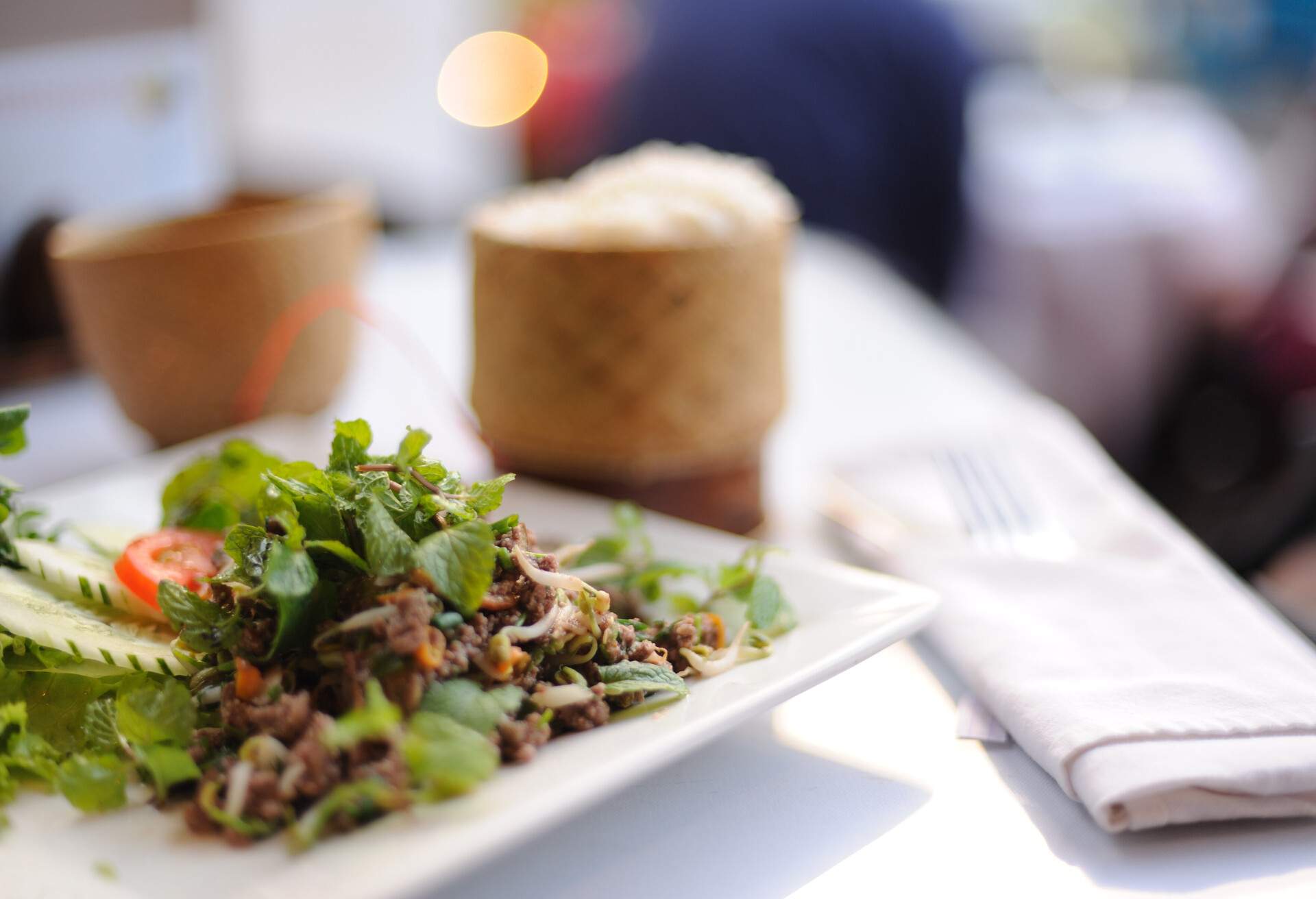 Traditional lao food - larb and basket.