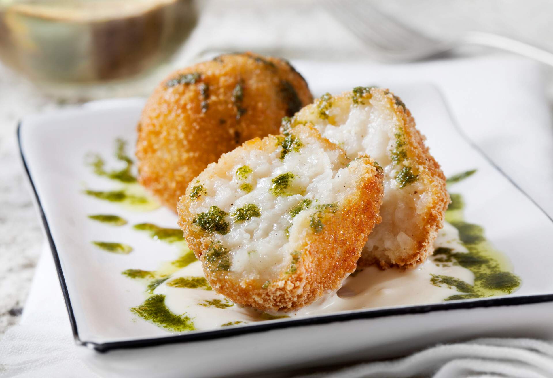 Creamy 3 Cheese Arancini with Garlic Aioli and Basil Oil