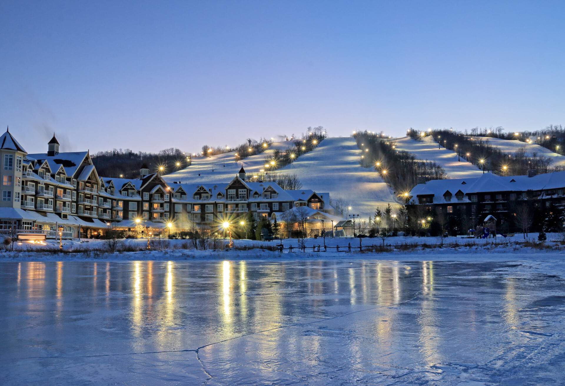Blue Mountain Village with ski slopes, lodges and spas in the evening