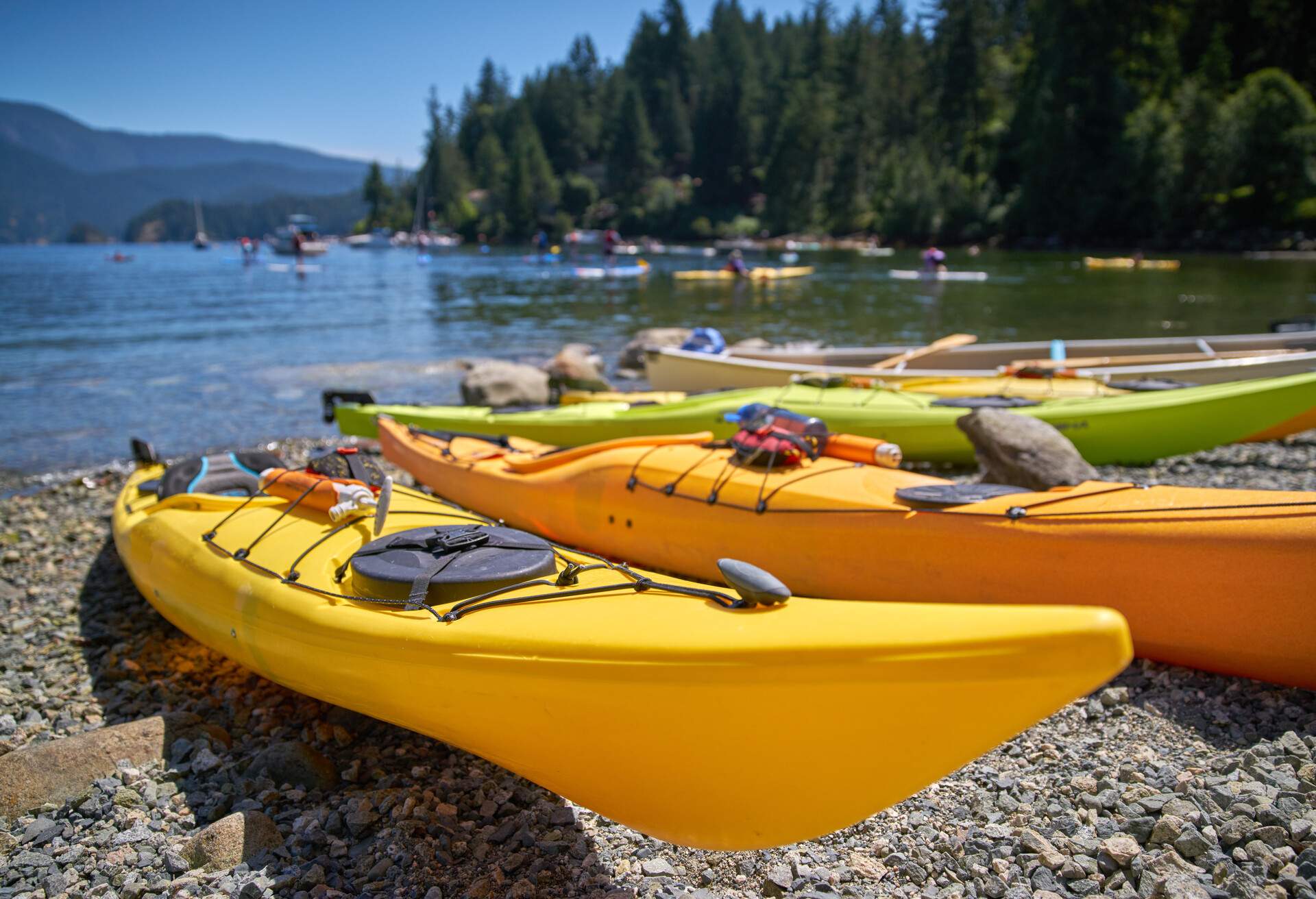 Kayaks on the beach of Deep Cove, British Columbia.