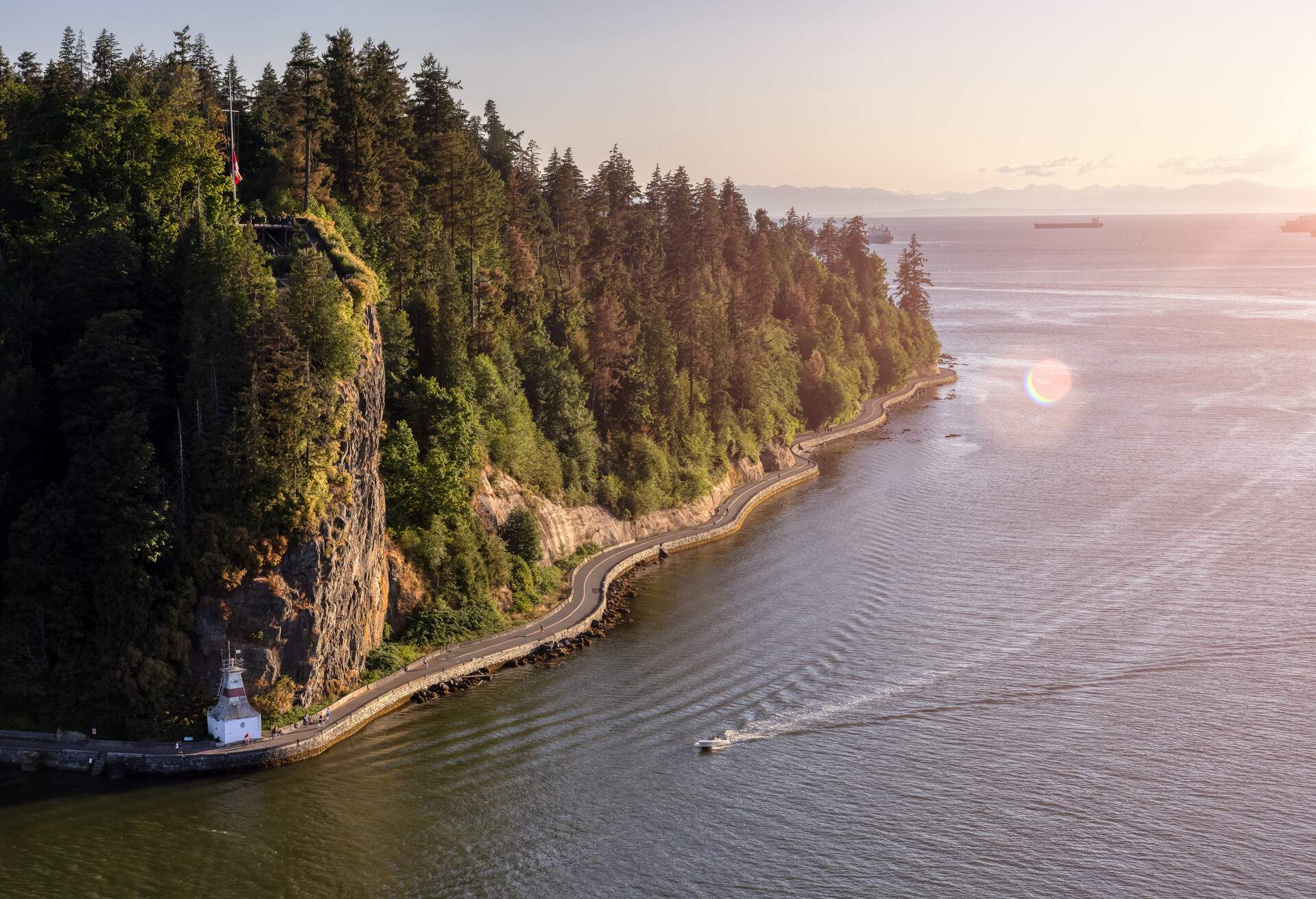 Aerial View from Lions Gate Bridge of Famous Seawall in Stanley Park. Sunny Summer Sunset. Downtown Vancouver, British Columbia, Canada.