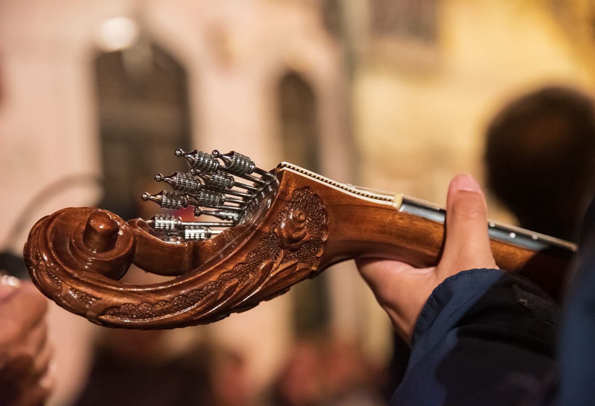 An artist playing fado in a Portuguese fado guitar