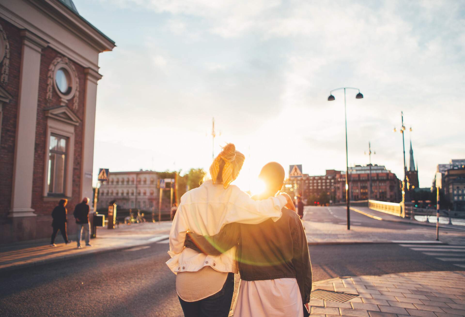 Lesbian couple embracing while visiting Stockholm and spending beautiful time together