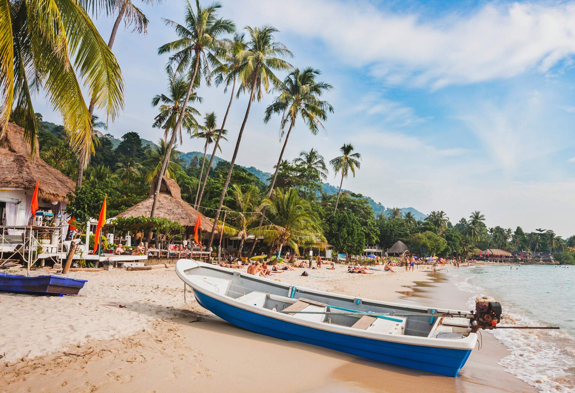 beautiful tropical beach in Thailand, wooden boat and palm trees on Koh Chang; Shutterstock ID 720580696; Purchase Order: SF-06928905; Job: ; Client/Licensee: ; Other: