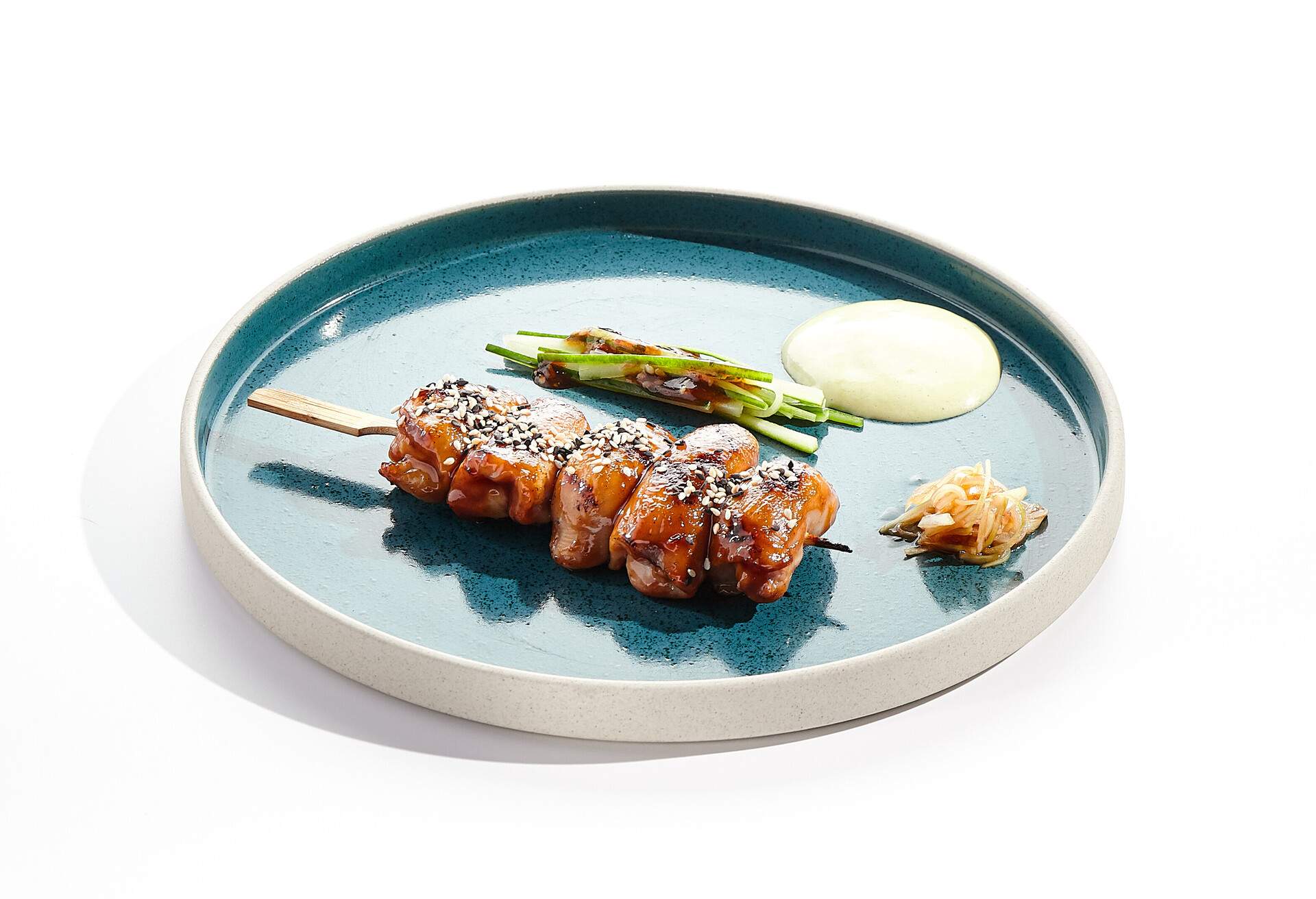 Traditional Japanese  food - skewer yakitori with chicken hearts and teriyaki sauce. Chicken skewer on bamboo stick in Japanese style. Bbq menu for asian restaurant. Yakitori on white background