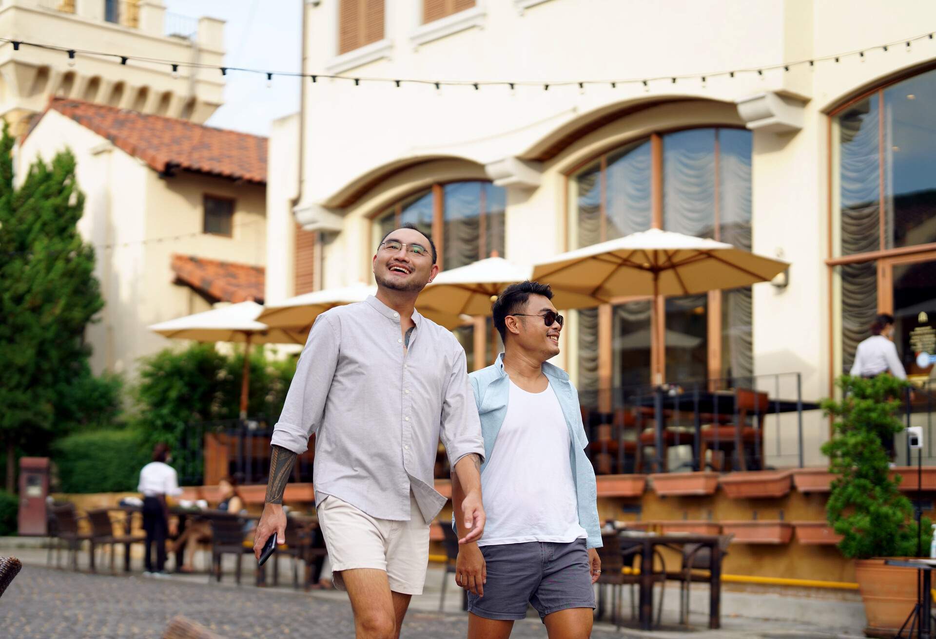 PEOPLE_MEN_COUPLE_GAY_HOLDING_HANDS_WALKING_RESTAURANT_BAR_CROPPED