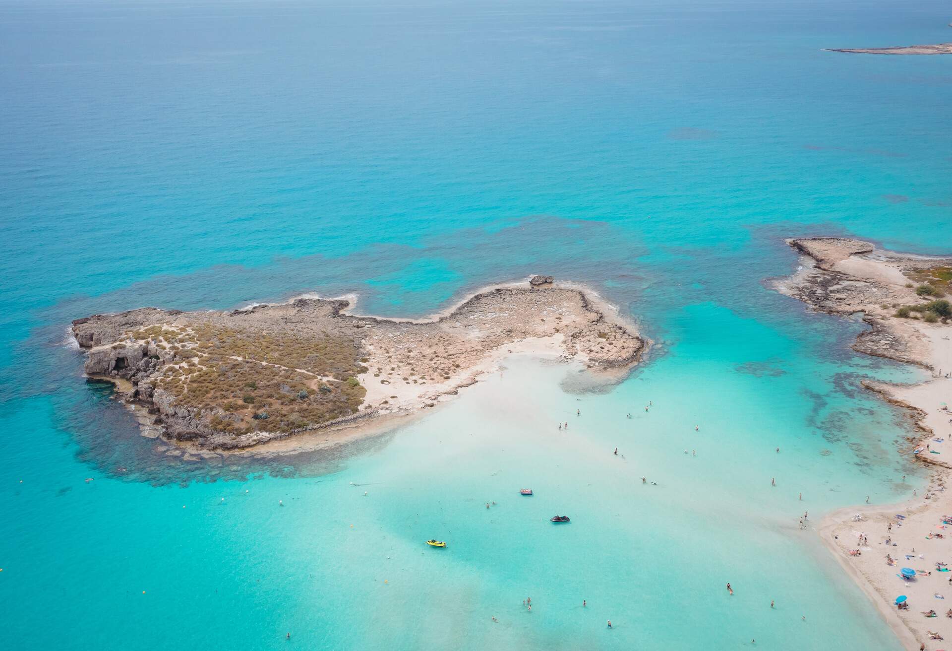 Aerial view of the most famous beaches in Cyprus - Nissi Beach. White sand beach with azure waters. Beautiful beach and panoramic views of Cyprus