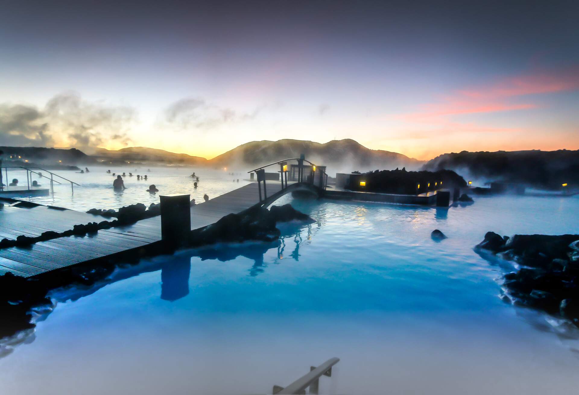 The sun was rising at the blue lagoon and it was a delight to swim in the warm baths with the outside temperature around zero degrees created a slight mist in the air as the cold air made contact to the warm water.