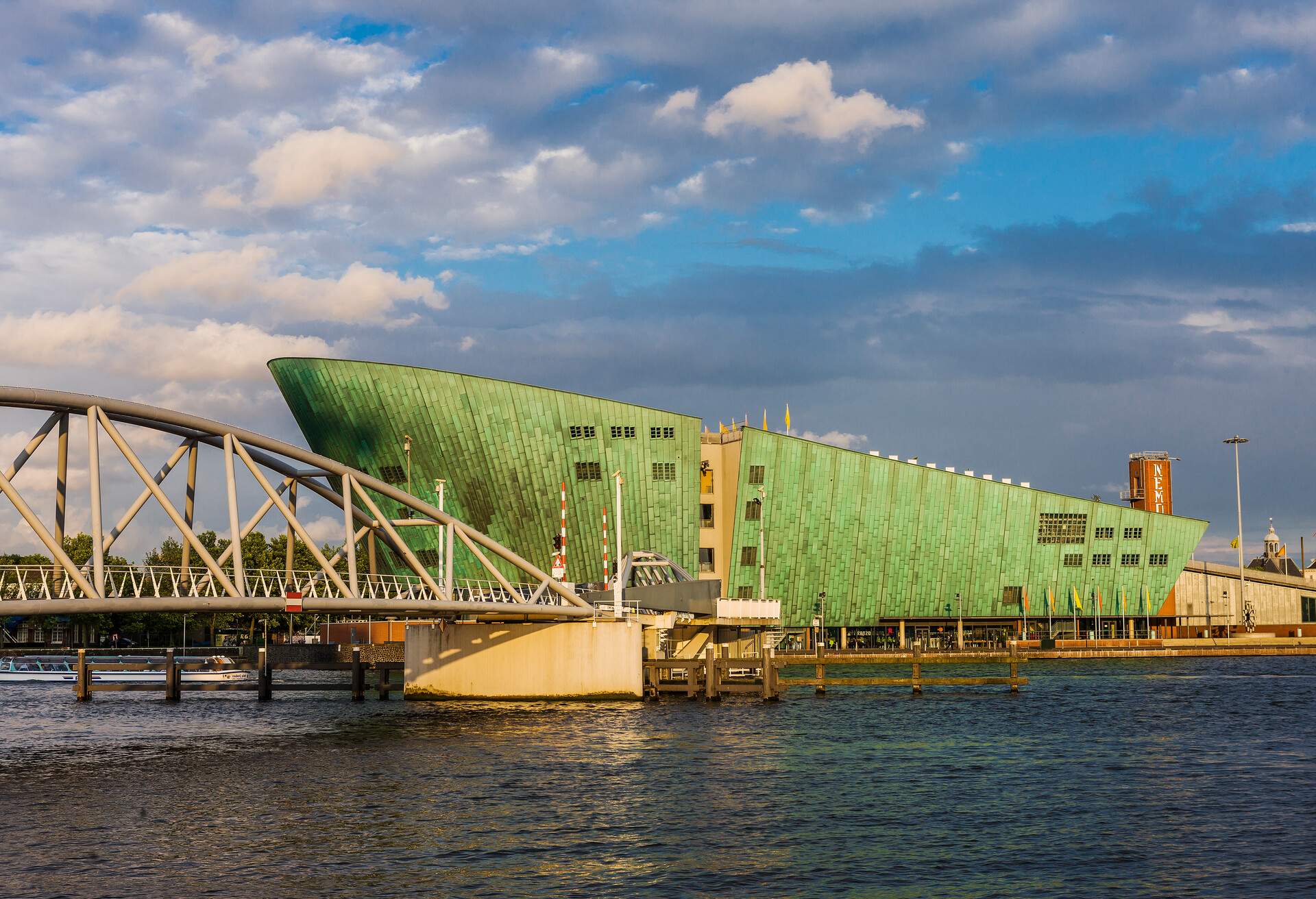 The NEMO Science Museum sitting along the edge of the harbour across the bridge.