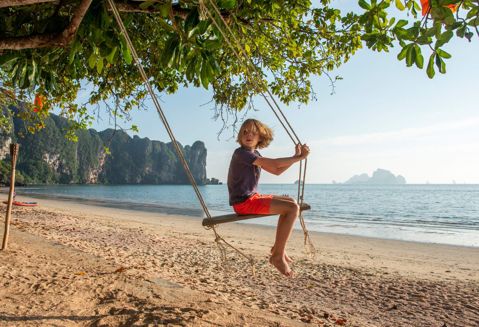 DEST_THAILAND_KRABI_AO_NANG_BEACH_BOY_KID_SEA_GettyImages-1363493073