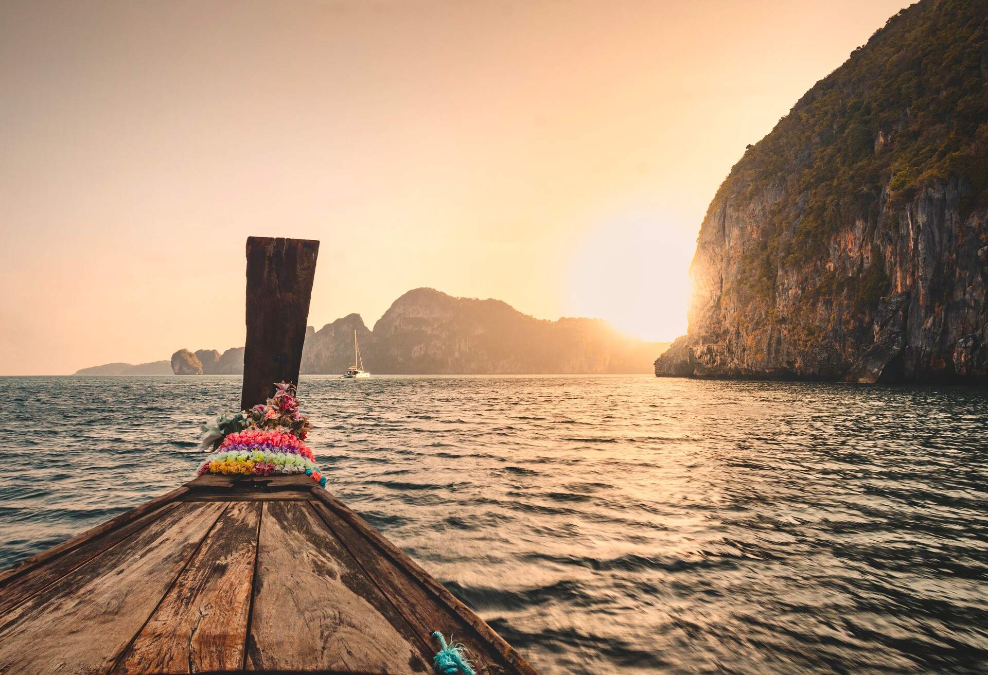 Tourists take Longtail boat to a Snorkel Spot near Phi Phi islands During Sunrise, Krabi Province, South, Thailand, Asia