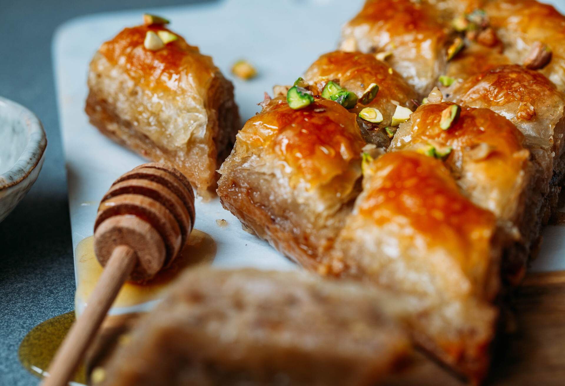 Sweet baklava with pistachio on marble background