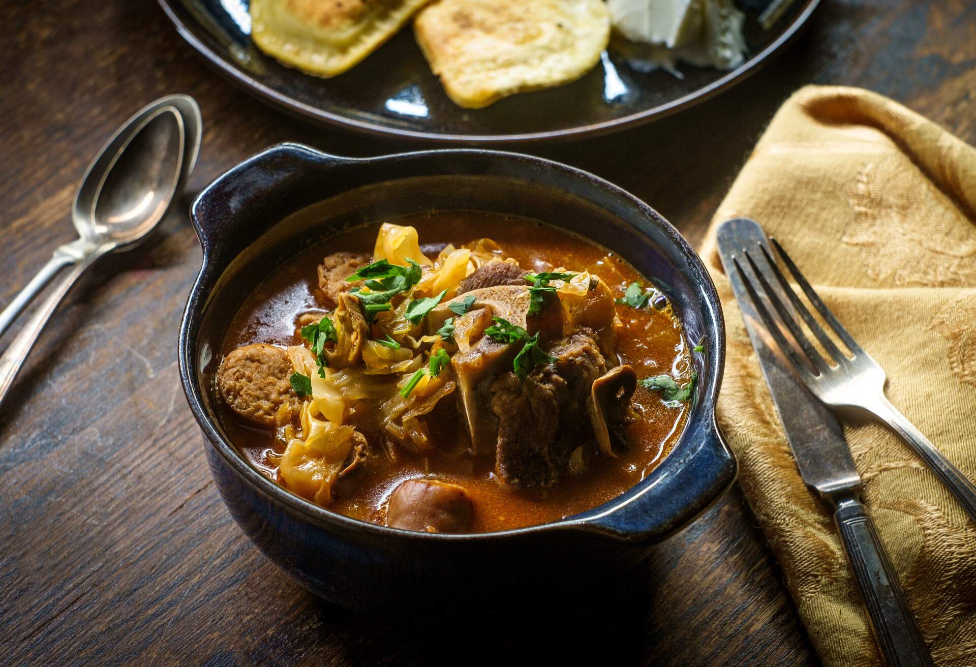 Polish hunters stew known as Bigos with pork loin sausage and lamb neck