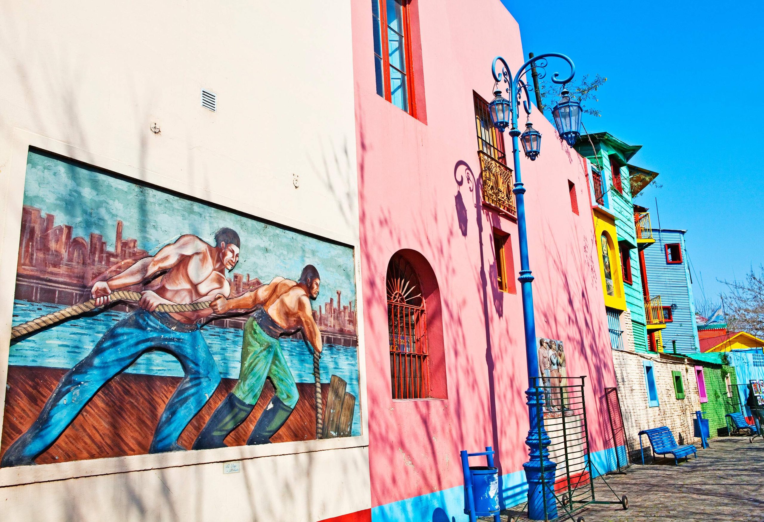 Colourful street in Buenos Aires with murals on a sunny day