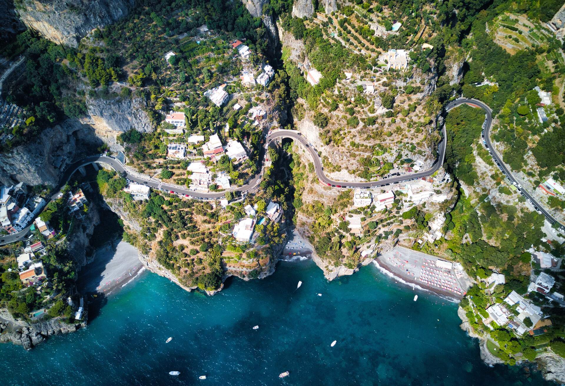 Coastline road near Positano, Italy - Aerial point of view. The winding road is just above the sea and the beaches. 