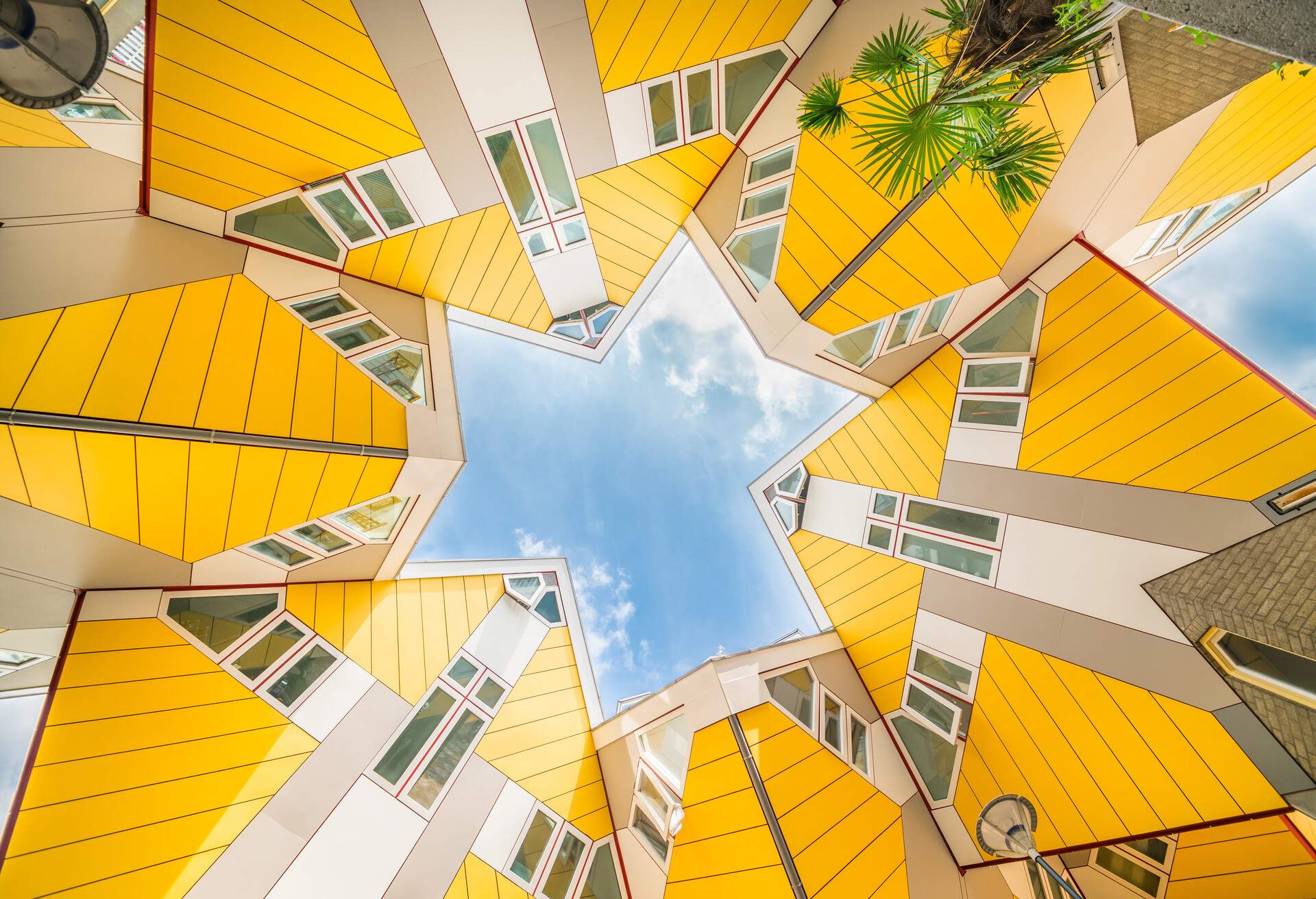 Star shapes formed where six Cube houses tilt into one another and intersect in Rotterdam, a quirky bright yellow architecturally unusual angular cube shape apartment block; Shutterstock ID 750309604; Purpose: Destiny; Brand (KAYAK, Momondo, Any): Any