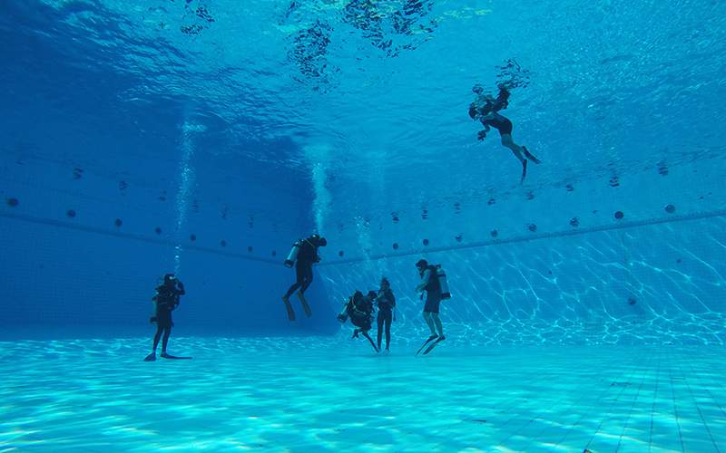 Before you take the plunge, take a scuba diving class in a pool