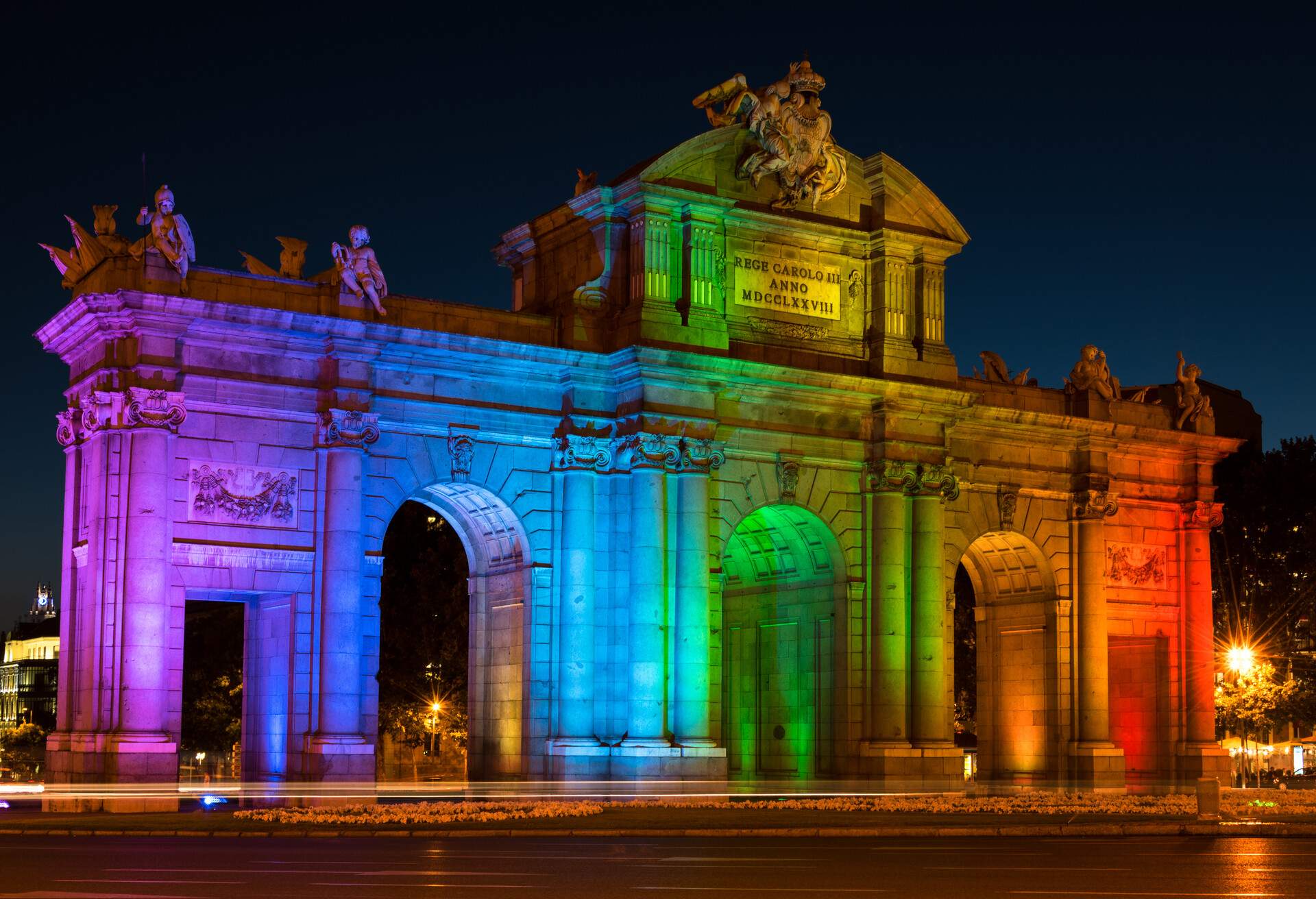 Alcala Gate (Puerta de Alcalá) in Madrid Celebrating World Pride Week Illuminated in Rainbow Colours