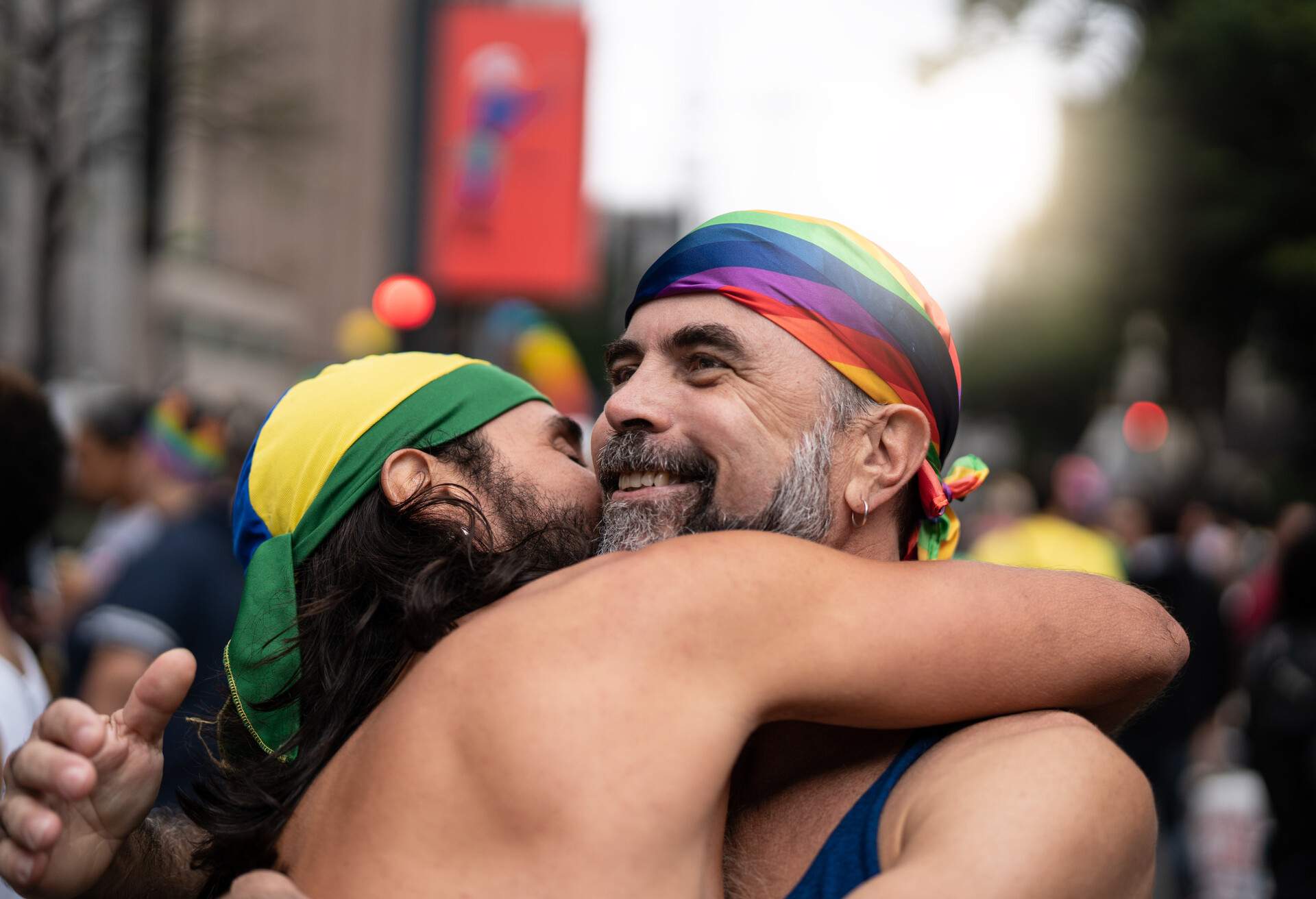 Two men hugging at pride event for LGBTQ+ community